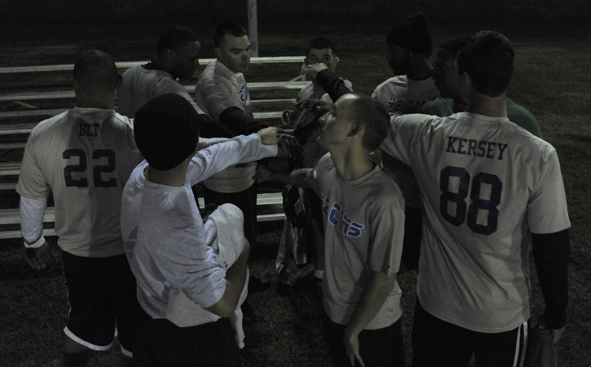 The 42nd CONS celebrates their win after a football game against HQAU Nov. 13, 2013. The CONS team beat HQAU 27-0, and now stands with a 4-2 record. (U.S. Air Force photo by Staff Sgt. Natasha Stannard)