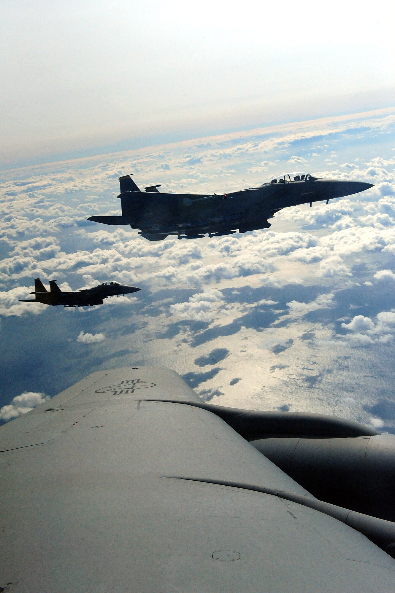 Two F-15E Strike Eagles fly alongside a KC-135R Stratotanker during Exercise RAZOR TALON, Nov. 15, 2013.  RAZOR TALON is a massive air-sea exercise conducted at Seymour Johnson Air Force Base, N.C., monthly, which combines resources from multiple units along the East Coast to refine skills and promote joint-service cohesiveness.  (U.S. Air Force photo by Airman 1st Class Brittain Crolley/Released)