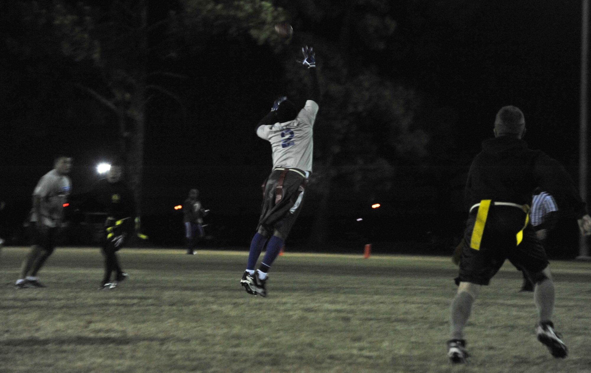 Austin Parker, 42nd CONS safety, intercepts the ball during CONS’ match against HQAU Nov. 13, 2013. Parker had two interceptions in the game, which his team won 27-0. (U.S. Air Force photo by Staff Sgt. Natasha Stannard)