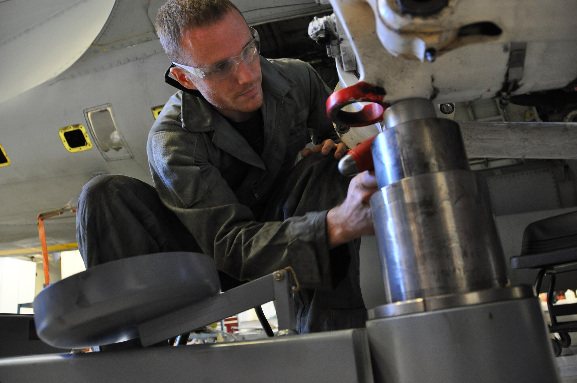 Technical Sergeant Robert Mills works on the landing gear of a KC-135R Stratotanker.  Mills is checking for gouges that need repairs.  This inspection is just one of several to be inspections performed during an ISO.  Members from the 507th Maintenance group will continue the in depth inspection until late November.  