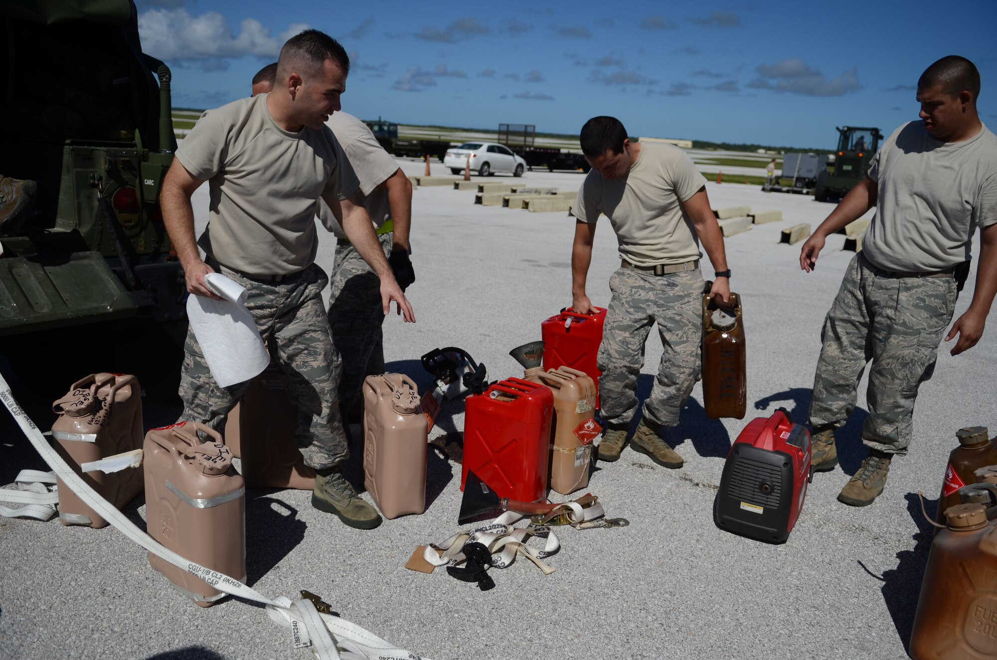 Airmen from the 36th Contingency Response Group load equipment and fuel into a HUMVEE Nov. 14, 2013, on the Andersen Air Force Base, Guam, flightline, before departing to support Operation Damayan in Tacloban, Philippines. The HUMVEE will be used to access the airfield at Tacloban to determine if it is fit to receive C-17s with supplies and equipment in support of the relief efforts. Operation Damayan is a U.S. humanitarian aid and disaster relief effort to support the Philippines in the wake of the devastating effects of Typhoon Haiyan. (U.S. Air Force photo by Senior Airman Marianique Santos/Released)