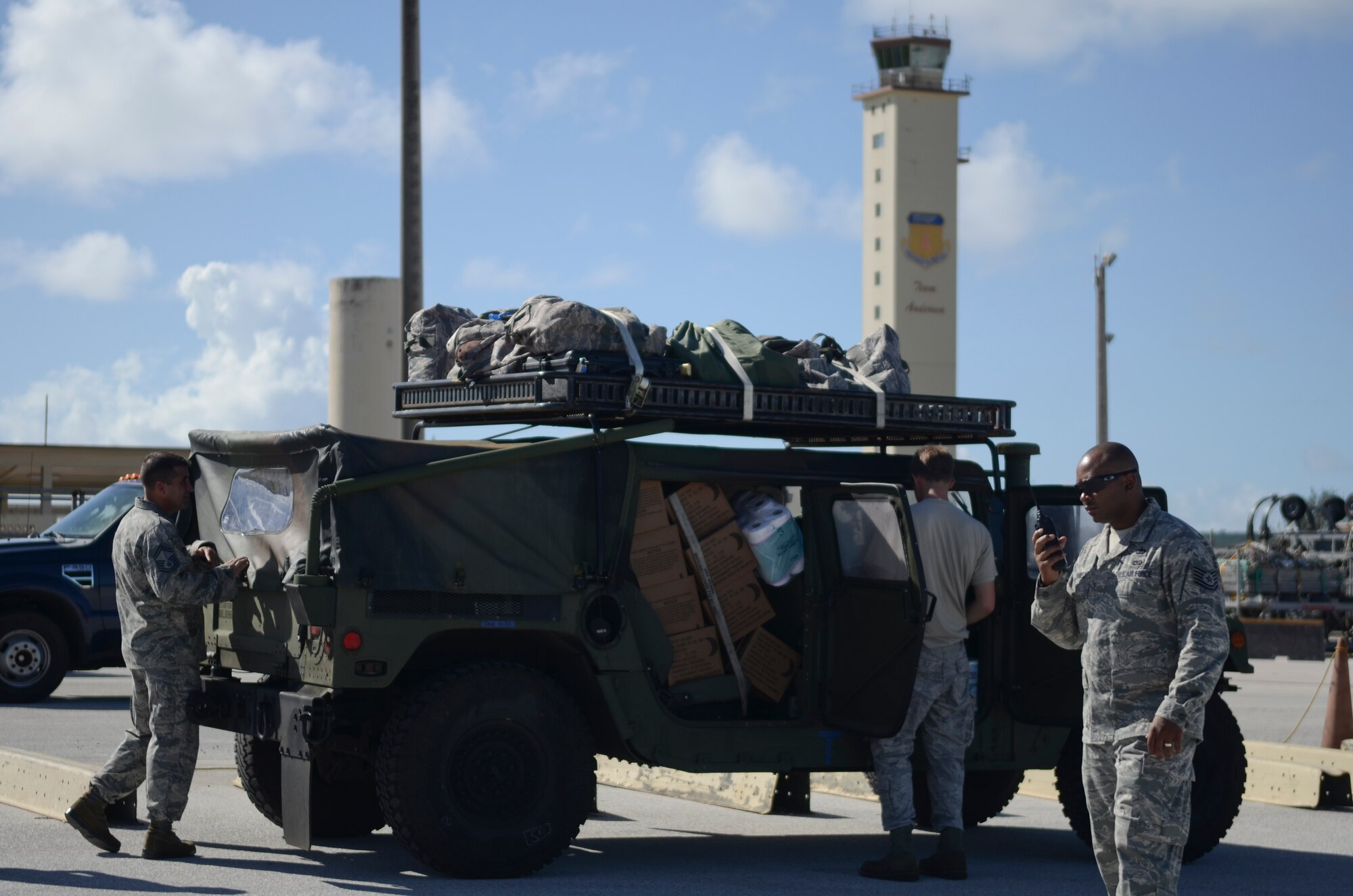 Airmen from the 36th Contingency Response Group prepare equipment and vehicles for transport Nov. 14, 2013, on the Andersen Air Force Base, Guam, flightline, before departing to support Operation Damayan in Tacloban, Philippines. The CRG assessment team is deploying to evaluate the airfield in Tacloban, to determine the airfield’s ability to host additional aircraft, particularly, C-17s, which will bring water purification systems and other relief supplies. Operation Damayan is a U.S. humanitarian aid and disaster relief effort to support the Philippines in the wake of the devastating effects of Typhoon Haiyan. (U.S. Air Force photo by Senior Airman Marianique Santos/Released)