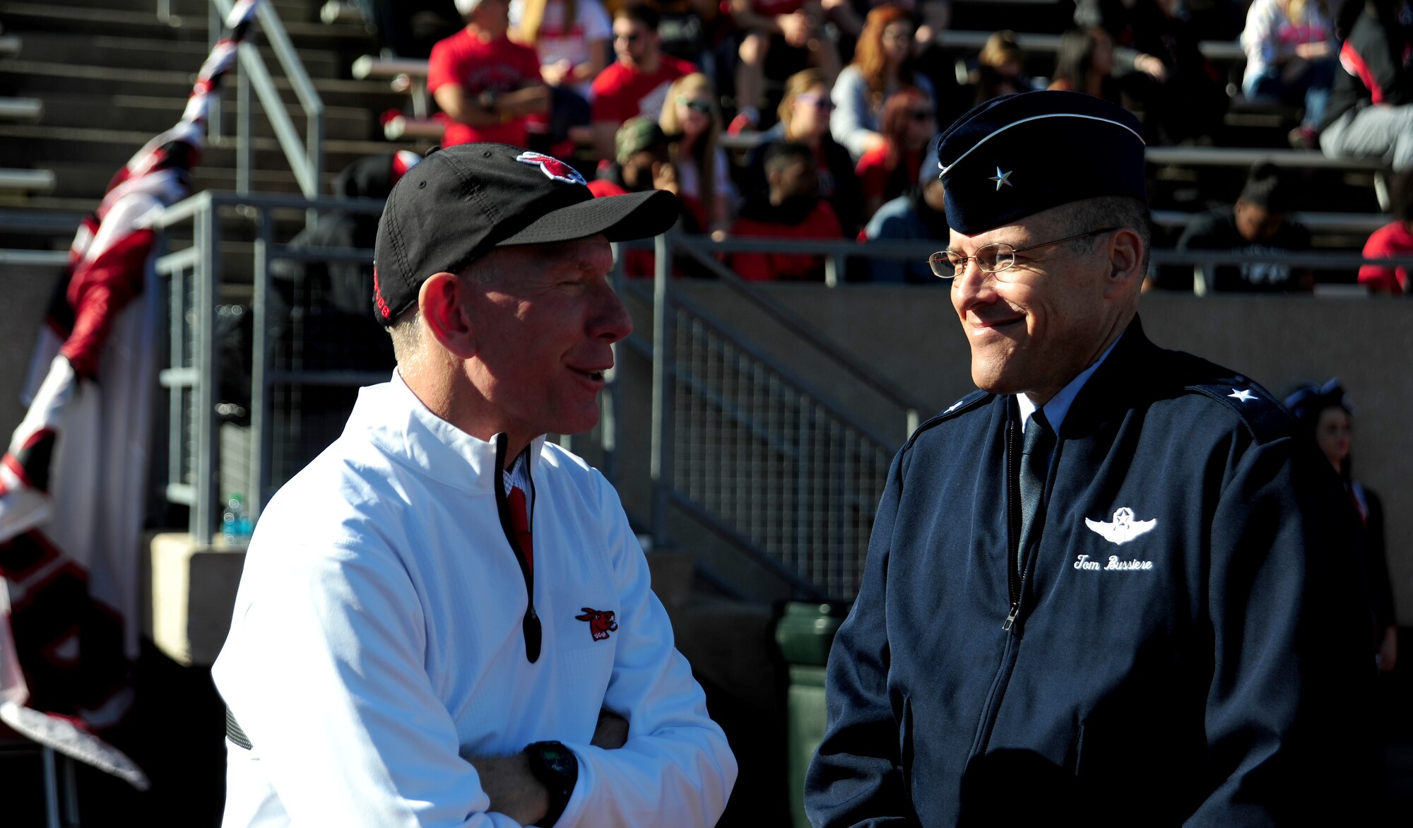 Dr. Charles Ambrose, University of Central Missouri president, shares a laugh with U.S. Air Force Brig. Gen. Thomas Bussiere during a military appreciation football game at the University of Central Missouri in Warrensburg, Mo. Nov. 9, 2013. Each year UCM hosts a military appreciation game to show gratitude to members of the armed forces past and present for serving their country. (U.S. Air Force photo by Staff Sgt. Nick Wilson/Released)