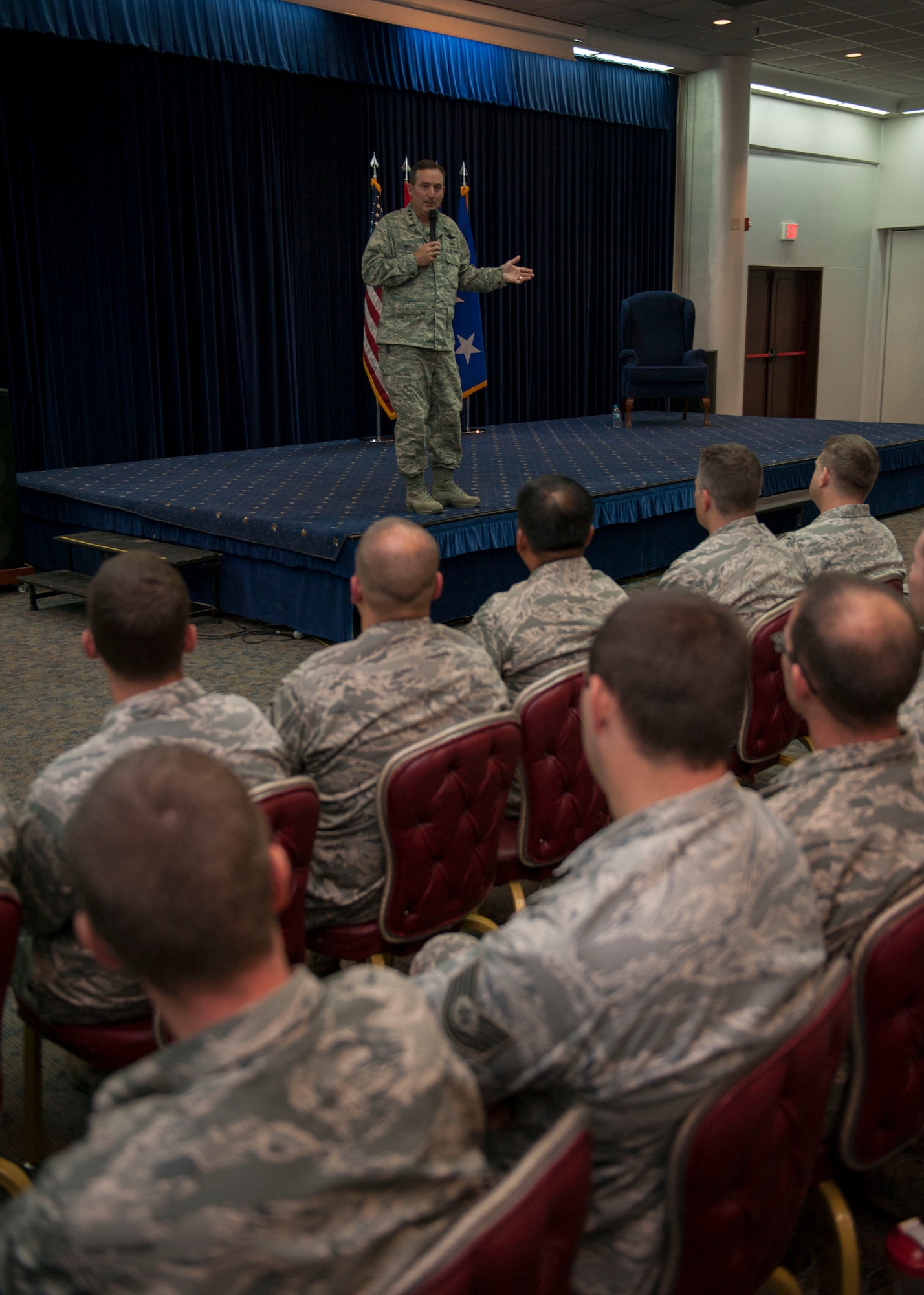 Airmen listen to Lt. Gen. Stephen Mueller, Inspector General of the Air Force during an all call Nov. 15, 2013 at Incirlik Air Base, Turkey.  The new inspection system is dependent on a culture where Airmen are empowered and encouraged to identify deficiencies. (U.S. Air Force photo by Senior Airman Chase Hedrick/Released)