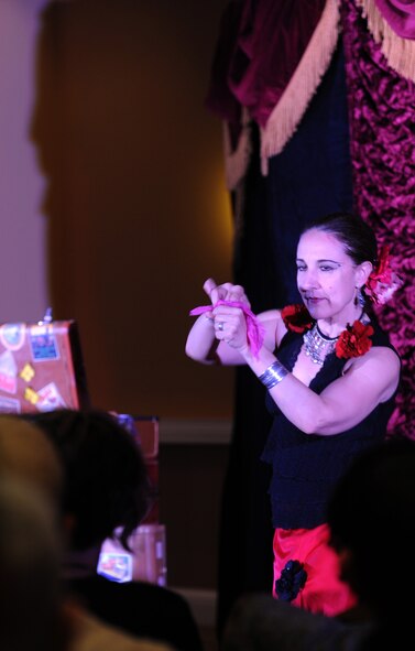 Susan Eyed, master illusionist, performs an illusion Saturday during a “Carnival of Illusion” show inside the Arizona Biltmore in Central Phoenix. “Carnival of Illusion” by Roland Sarlot and Eyed is a Victorian-era inspired vaudeville show taking audiences on a worldwide journey filled with “magic, mystery and ooh la la.”  (U.S. Air Force photo/Staff Sgt. Nestor Cruz)