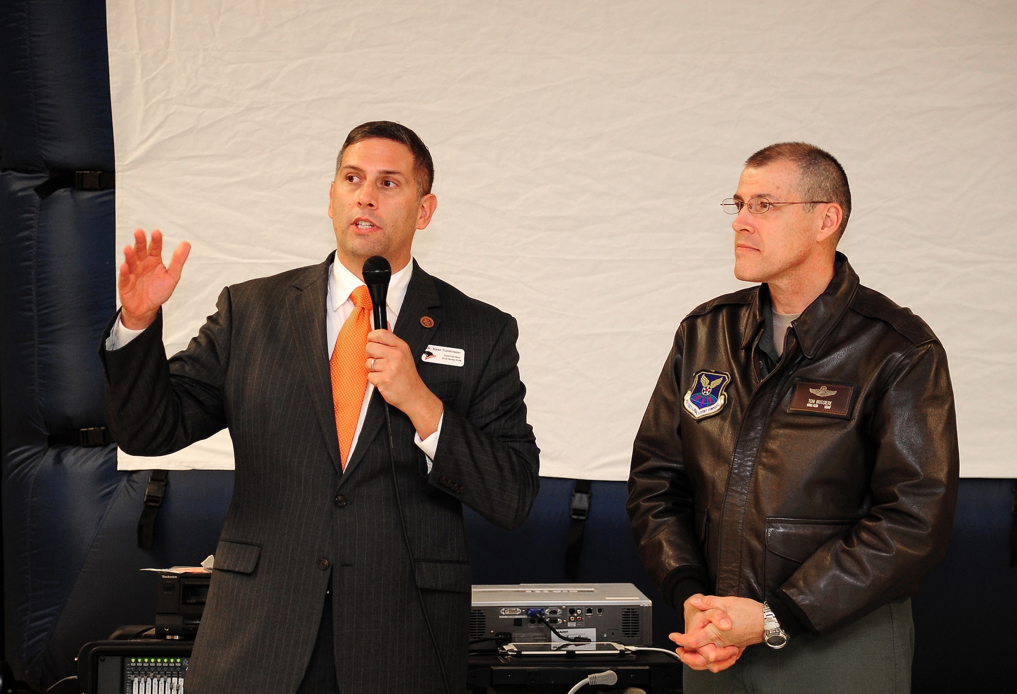 Dr. Jaret Tomlinson, left, Knob Noster R-VIII School District superintendent, explains planned construction projects during the Whiteman Elementary School (WES) rededication ceremony at Whiteman Air Force Base, Mo., Nov. 14, 2013. U.S. Air Force Brig. Gen. Thomas A. Bussiere, 509th Bomb Wing commander, and dozens of educators attended to hear about projects planned to improve schools throughout the district. (U.S. Air Force photo by Staff Sgt. Brigitte N. Brantley/Released)