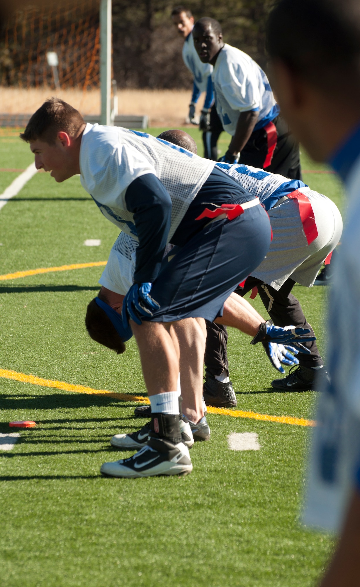 131109-F-GZ967-027 The Airmen of the United States Air Force Academy team line up, prepared to run a play against the Airmen of F.E. Warren during a game at the academy Nov. 9. The game was a championship match that decided who would be the victor of the Rocky Mountain Regional Military Championship for flag football. (U.S. Air Force photo by Airman 1st Class Brandon Valle)
