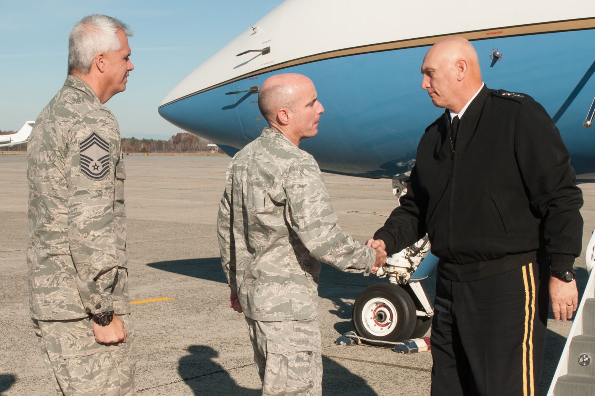 HANSCOM AIR FORCE BASE, Mass. -- Col. Lester A. Weilacher, 66th Air Base Group commander, and Chief Master Sgt. Mitchell Balutski, Hanscom Air Force Base senior enlisted advisor, welcome Gen. Raymond T. Odierno, Chief of Staff of the U.S. Army on the flightline Nov. 14. (U.S. Air Force photo by Mark Herlihy)