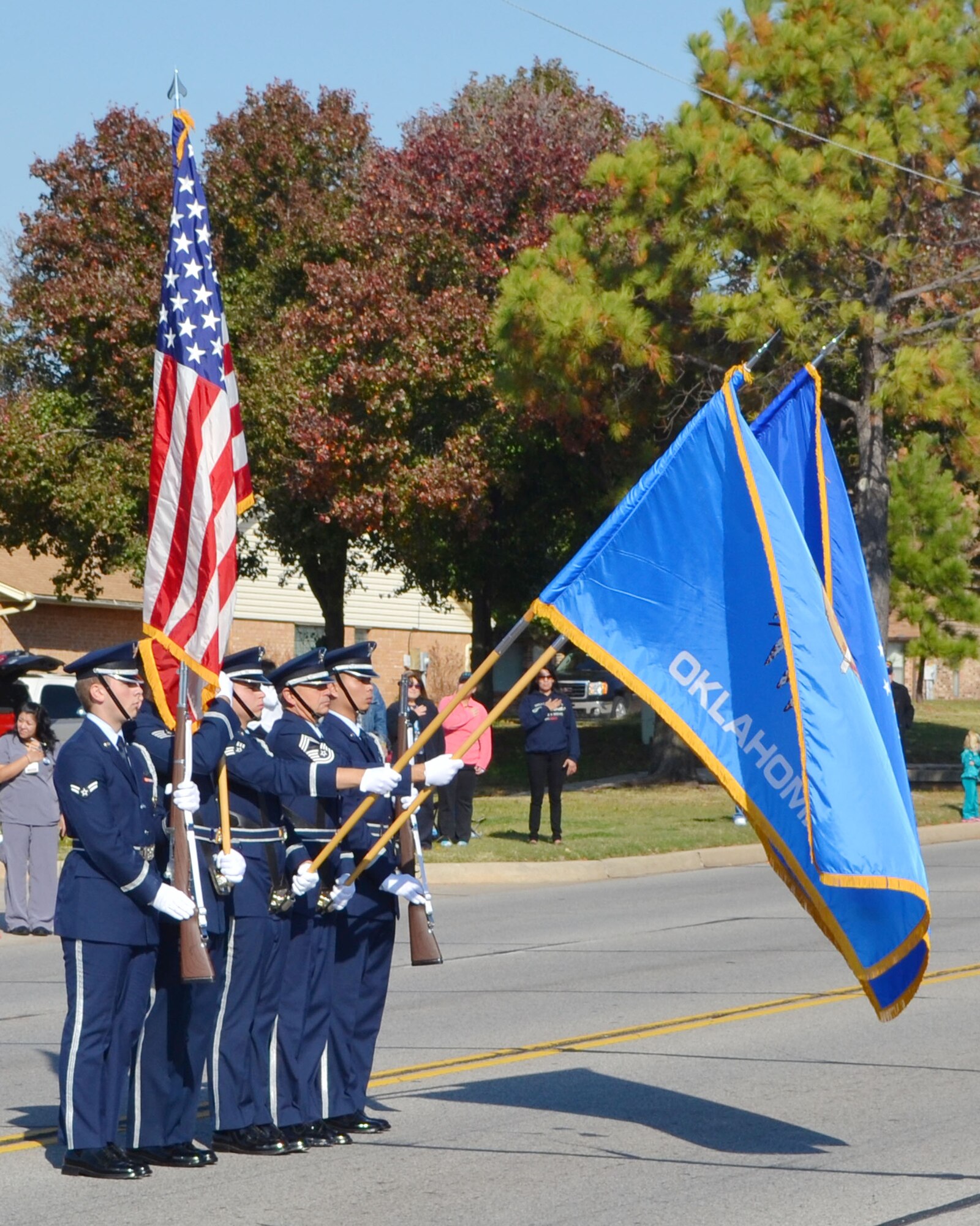 Members of the Team Tinker Honor Guard, present the colors during the Midwest City Veterans Day Parade on Douglas Blvd Nov. 11. The annual city-sponsored parade featured many military members from Team Tinker, active and retired. For more photos from the parade and other Veterans Day activities from the surrounding community see pages 8-9.  (Air Force photo by Jerry Bryza)