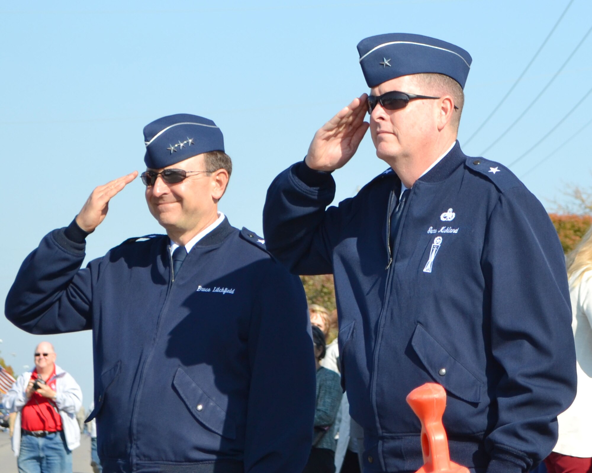 Air Force Sustainment Center Commander Lt. Gen. Bruce Litchfield, left, and Oklahoma City Air Logistics Complex Commander Brig. Gen. Gene Kirkland render a salute during the Midwest City Veterans Day Parade Nov. 11. (Air Force photo by Jerry Bryza)