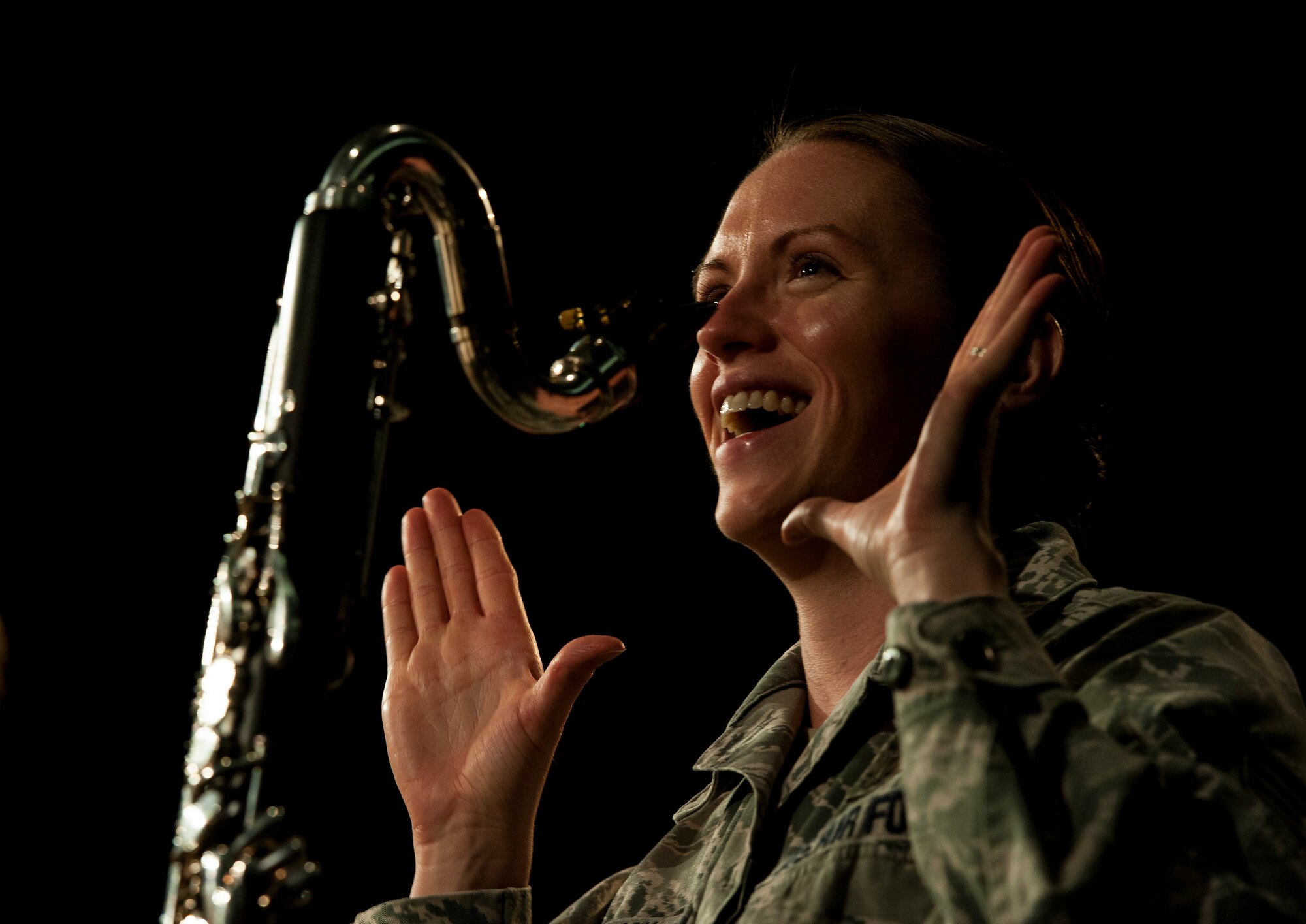 Staff Sgt. Chantelle Friedman, regional band clarinet player for the U.S. Air Forces in Europe Band, gives feedback on how the clarinet section sounds during a rehearsal, Oct. 30, 2013, Ramstein Air Base. The USAFE Band travels throughout Europe, Africa and the Middle East, strengthening the reputation of the Air Force. (U.S. Air Force photo/Senior Airman Damon Kasberg)