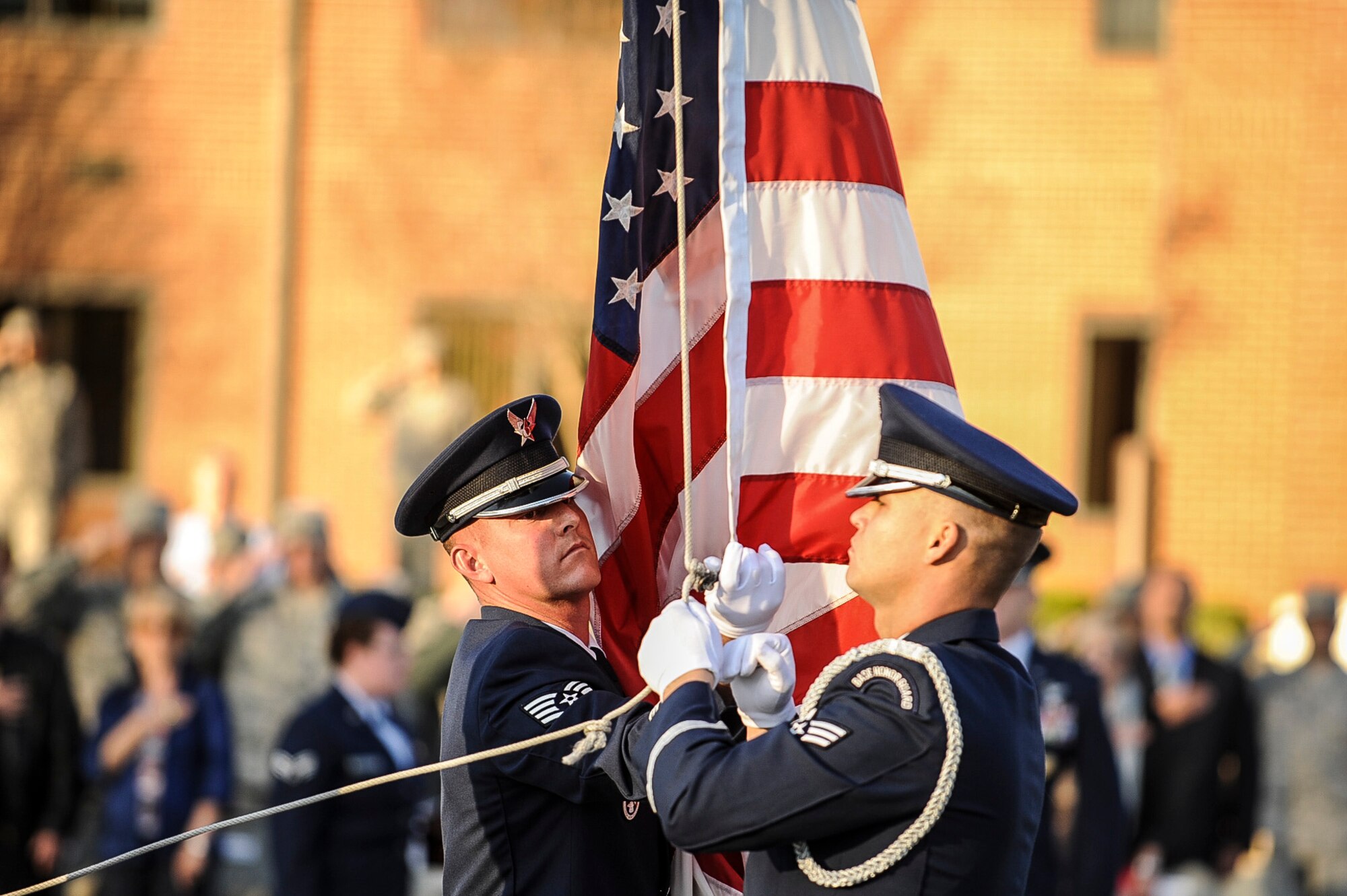 Members of the base honor guard retrieve the flag during the Veterans Day Retreat Ceremony Nov. 8, 2013, at Little Rock Air Force Base, Ark. Veterans Day is observed Nov. 11 and was originally known as Armistice Day or Remembrance Day. (U.S. Air Force photo by Airman 1st Class Cliffton Dolezal)
