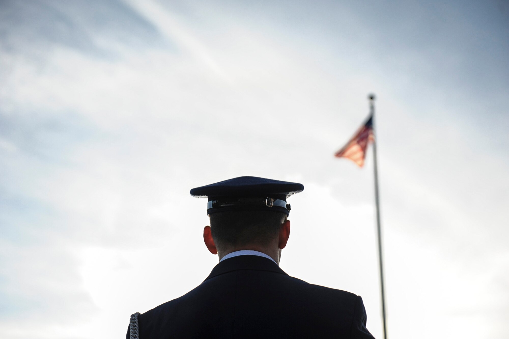 A member of the base honor guard stands at parade rest while waiting for the Veterans Day Retreat Ceremony to begin Nov. 8, 2013, at Little Rock Air Force Base, Ark. Veterans Day is observed Nov. 11 and was originally known as Armistice Day or Remembrance Day. (U.S. Air Force photo by Airman 1st Class Cliffton Dolezal)