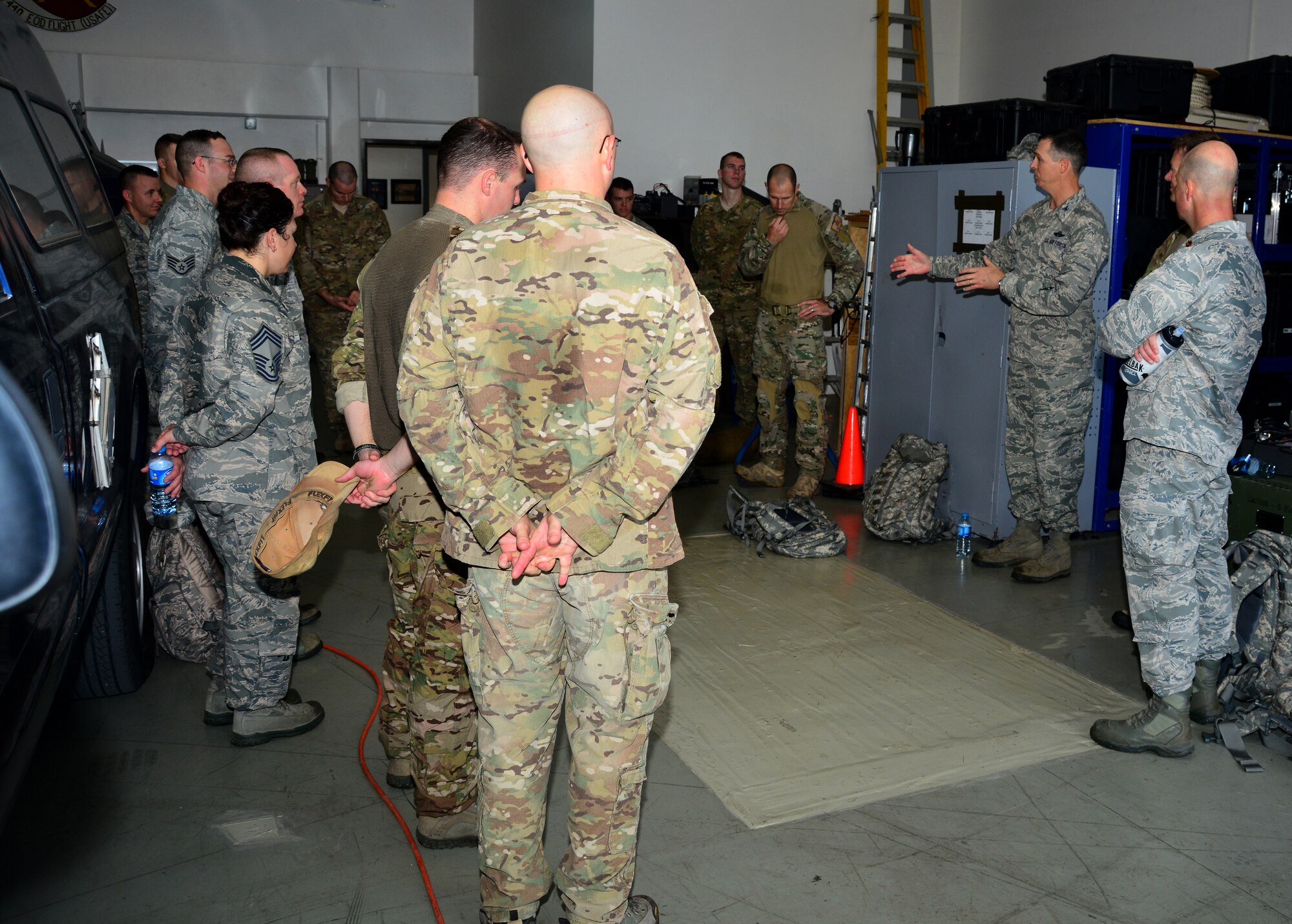 Col. Craig Wills, 39th Air Base Wing commander, speaks to Airmen from the 39th Civil Engineer Squadron Explosive Ordinance Disposal Flight after completing a 3.5 mile ruck march Nov. 12, 2013, at Incirlik Air Base, Turkey. The ruck march was one of several activities to bring safety awareness to EOD personnel and to inform them of helping agencies such as mental health and Military One Source when returning from a deployment. (U.S. Air Force photo by Staff Sgt. Eric Summers Jr./Released)