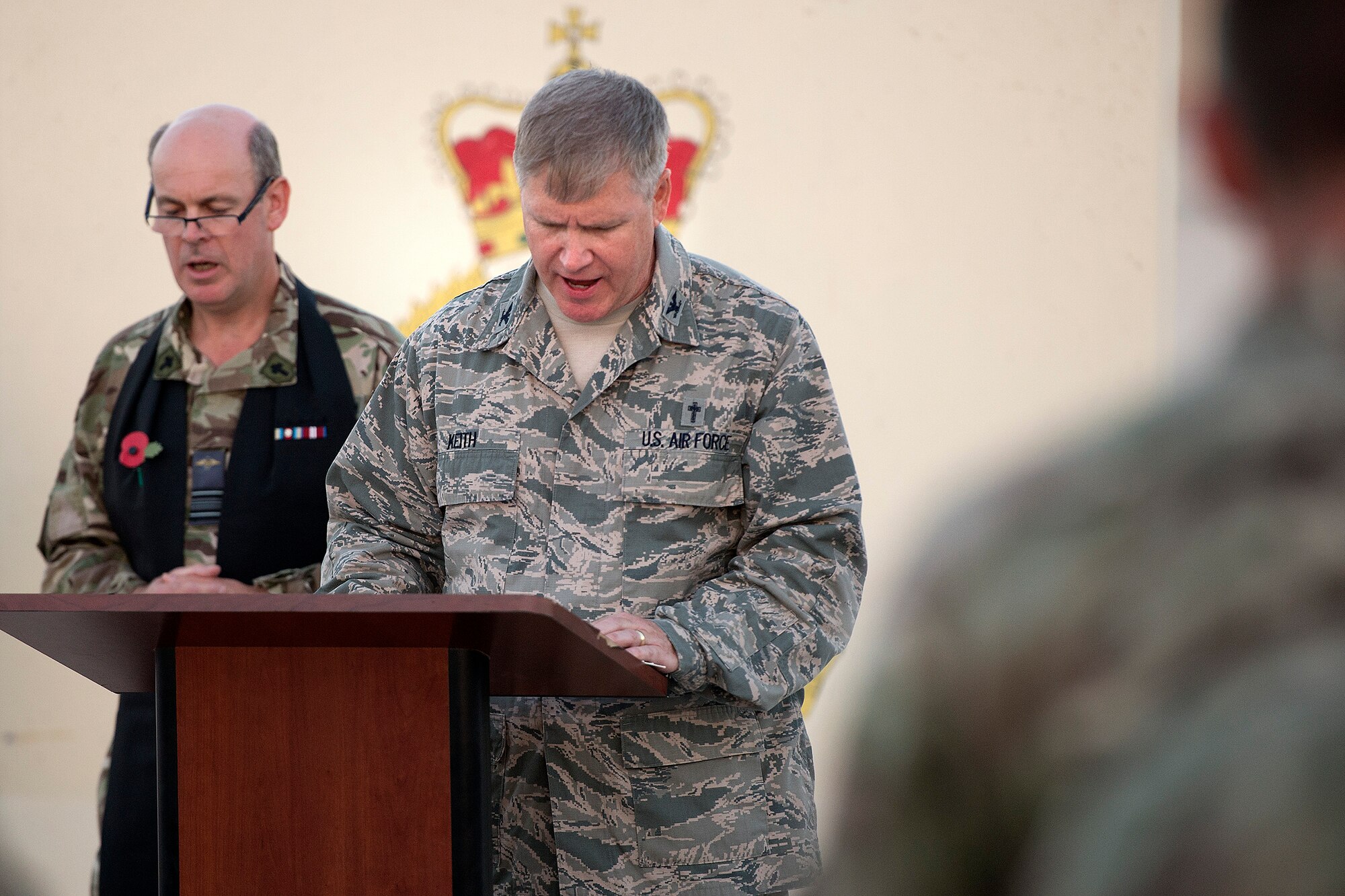 Col. Steven Keith, 379th Air Expeditionary Wing chaplain, participates in a sunset remembrance ceremony at the Royal Air Force's 83rd Expeditionary Air Group headquarters Nov. 9, 2013. The RAF's 83 EAG is responsible for all English units operating in Afghanistan and the Middle East. (USAF Photo by Master Sgt. Ben Bloker)
