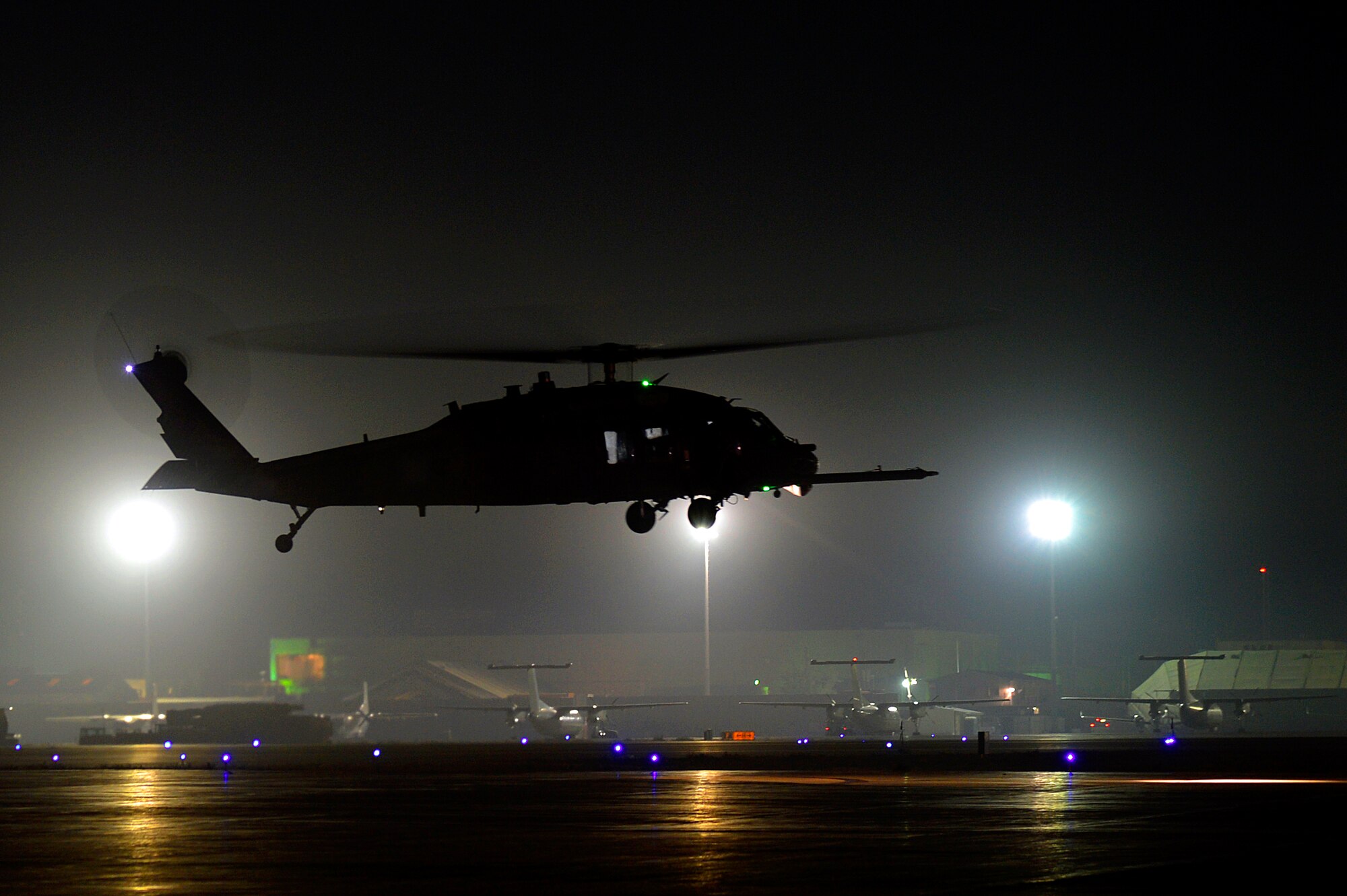 A HH-60G Pave Hawk takes off at Bagram Airfield, Afghanistan, Nov.13, 2013. Service members assigned to the 83rd Expeditionary Rescue Squadron conducted a night training mission to ensure they maintain proficiency of their mission capabilities. (U.S. Air Force photo by Senior Airman Kayla Newman/Released)