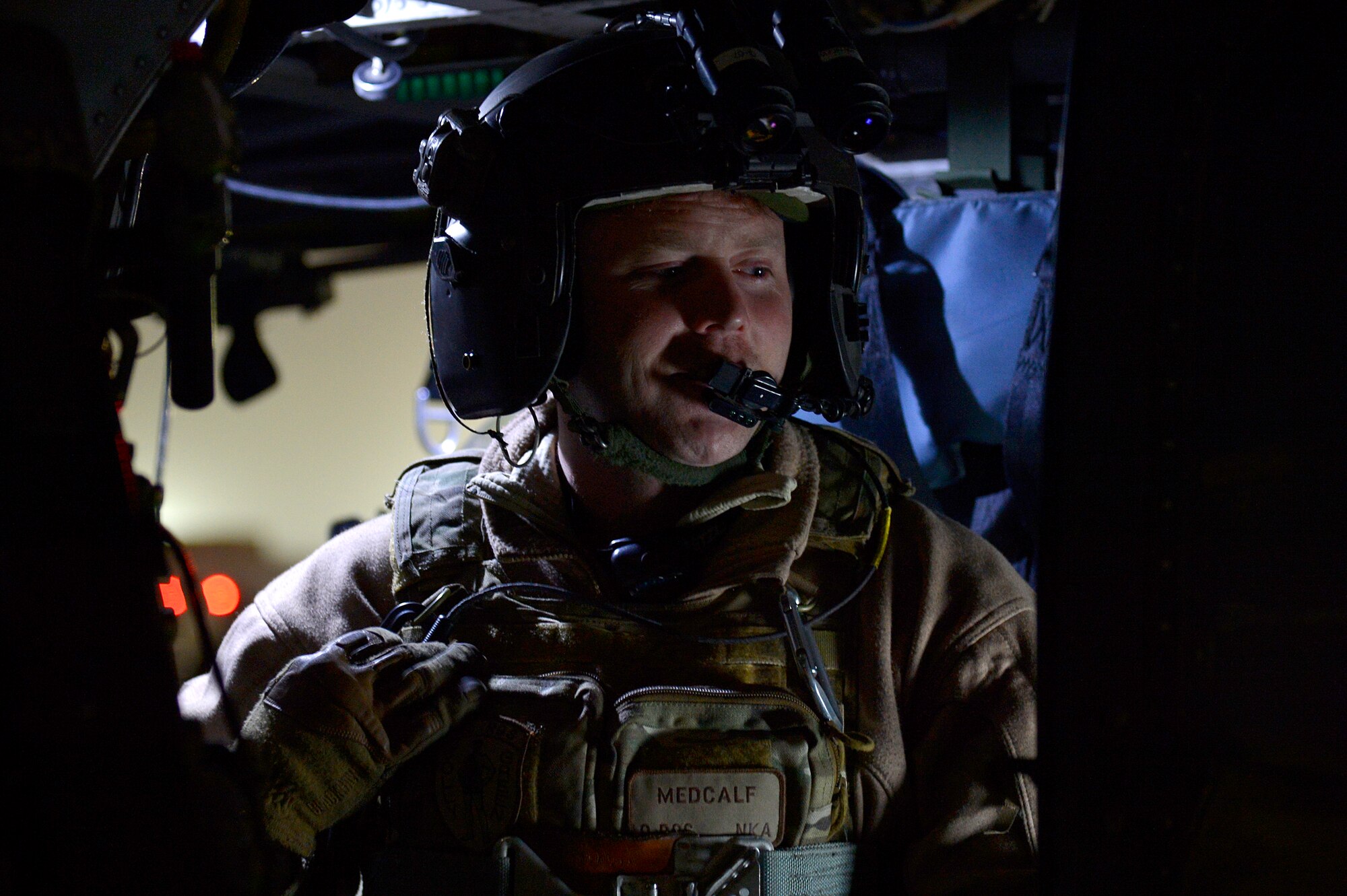A U.S. Air Force member of the 83rd Expeditionary Rescue Squadron prepares for a training mission at Bagram Airfield, Afghanistan, Nov.13, 2013. The 83rd ERQS utilizes the HH-60G Pave Hawk's to accomplish their assault, secure and dominate rescue objectives. (U.S. Air Force photo by Senior Airman Kayla Newman/Released)
