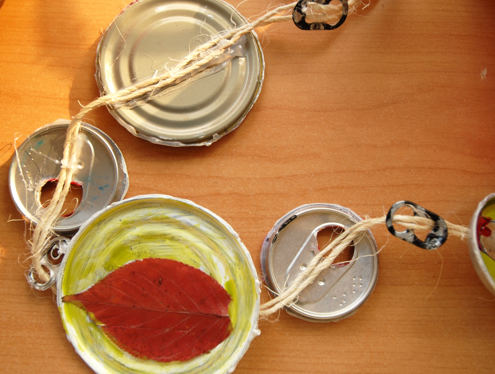 An art project dedicated to highlighting recyclable products is displayed on a table outside the Osan High School auditorium at Osan Air Base, Republic of Korea, Nov. 14, 2013. The Qualified Recycling Program committee held an art contest in an effort to raise awareness for America Recycles Day. (U.S. Air Force photo/ 1st Lt. Kay M. Nissen)
