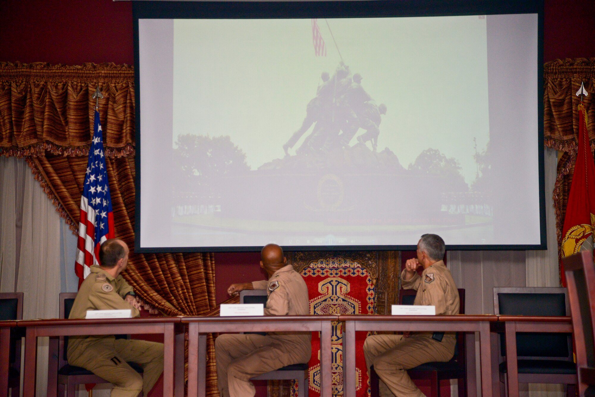 Brig. Gen. David Wheeler (left) Combined Air and Space Operations Center Director, Maj. Gen. Charles Q. Brown Jr., Air Forces Central Command deputy commander (center) and Brig. Gen. Roger H. Watkins (right) 379th Air Expeditionary Wing commander, watch the U.S. Marine Corps birthday message video at the 379th Air Expeditionary Wing during the U.S. Marine Corps 238th birthday cake cutting ceremony in Southwest Asia, Nov. 10, 2013. It is customary for Marines to cut a birthday cake during the ceremony.  The passing of cake from the oldest Marine to the youngest symbolizes the passing history and tradition from the outgoing generation of Marines to the incoming. (U.S. Air Force photo/Tech. Sgt. Joselito Aribuabo)
