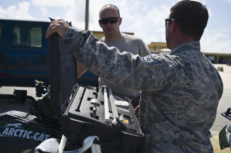 Airmen from the 36th Contingency Response Group check if equipment is packed correctly Nov. 14, 2013, on the Andersen Air Force Base, Guam, flightline, before departing to support Operation Damayan in Tacloban, Philippines. Operation Damayan is a U.S. humanitarian aid and disaster relief effort to support the Philippines in the wake of the devastating effects of Typhoon Haiyan. (U.S. Air Force photo by Senior Airman Marianique Santos/Released)