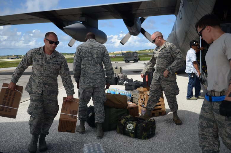 Airmen from the 36th Contingency Response Group load equipment into a C-130 Hercules Nov. 14, 2013, on the Andersen Air Force Base, Guam, flightline, before departing to support Operation Damayan in Tacloban, Philippines. Operation Damayan is a U.S. humanitarian aid and disaster relief effort to support the Philippines in the wake of the devastating effects of Typhoon Haiyan. (U.S. Air Force photo by Senior Airman Marianique Santos/Released)