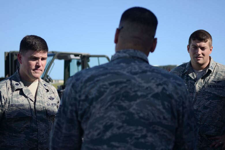 Airmen from the 36th Contingency Response Group discuss the mission Nov. 14, 2013, on the Andersen Air Force Base, Guam, flightline, before departing to support Operation Damayan in Tacloban, Philippines. The CRG will work to set up and maintain contingency airfield operations at Tacloban. Operation Damayan is a U.S. humanitarian aid and disaster relief effort to support the Philippines in the wake of the devastating effects of Typhoon Haiyan. (U.S. Air Force photo by Senior Airman Marianique Santos/Released)