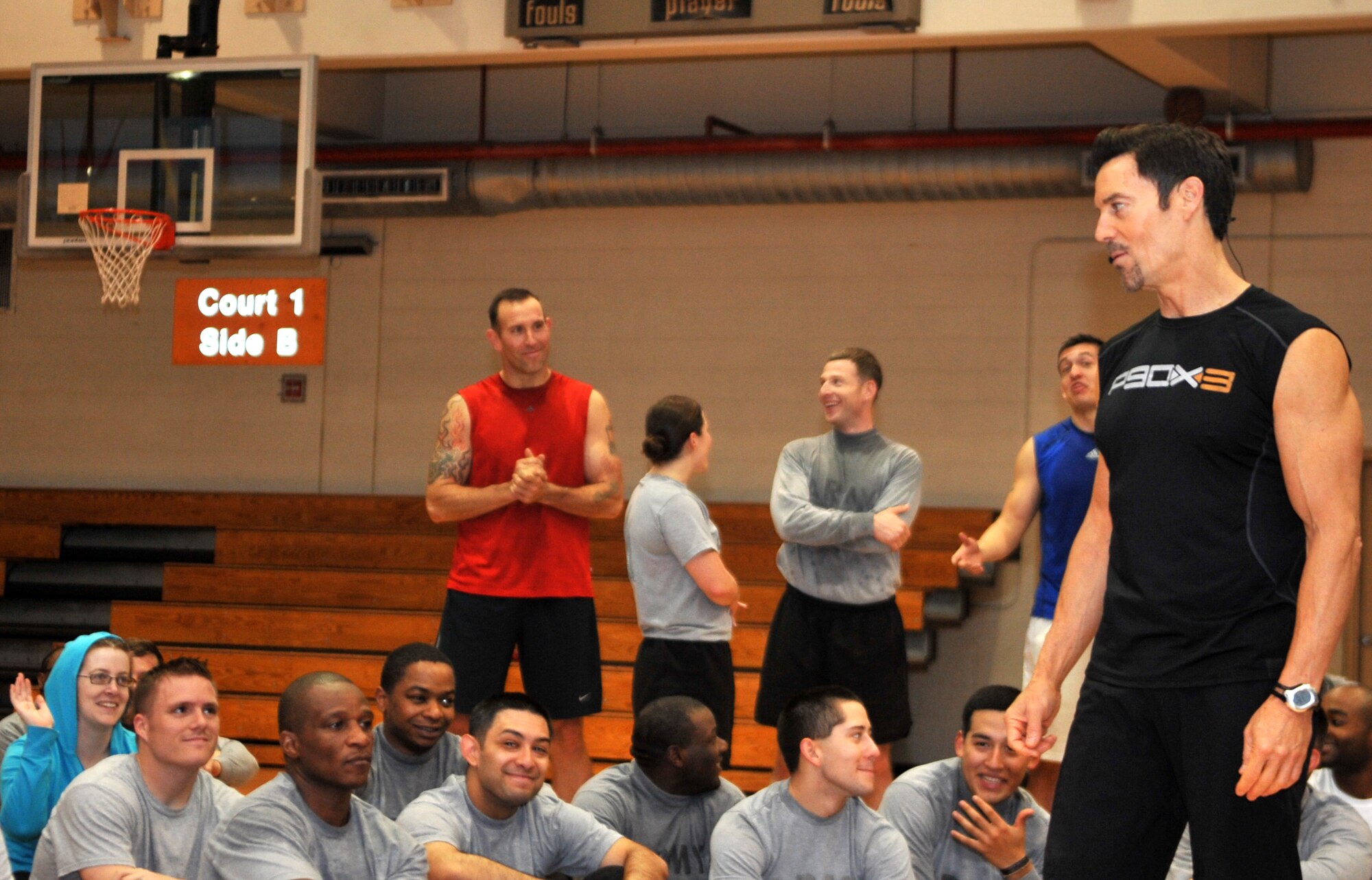 Tony Horton, P90X creator, leads a discussion about healthy living after a P90X workout in the fitness center at Osan Air Base, Republic of Korea, Nov. 15, 2013. Horton explained that exercise leads to increased cognition and other intellectual advantages. (U.S. Air Force photo/Airman 1st Class Ashley J. Thum)
