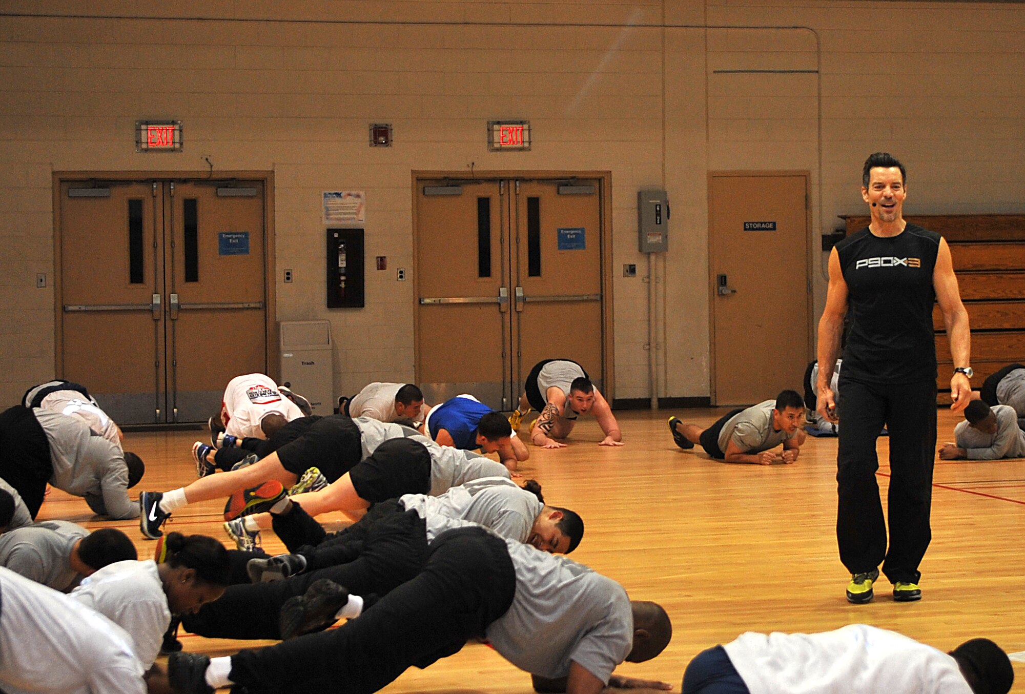 Tony Horton, P90X creator, counts down while members of Team Osan plank in the fitness center at Osan Air Base, Republic of Korea, Nov. 15, 2013. Horton led participants in 60-minute workouts at 6 a.m. and at noon. (U.S. Air Force photo/Airman 1st Class Ashley J. Thum)