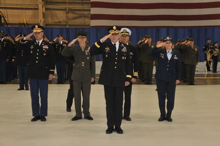 Major General John Uberti, Chief of Staff, U.S. Strategic Command, acting as commander of troops, presents the command to outgoing commander General C. Robert Kehler during the U.S. Strategic Command change of command ceremony at Offutt Air Force Base, Omaha, Nebraska Nov. 15, 2013.  (Photo by Steve Cunningham / Released)