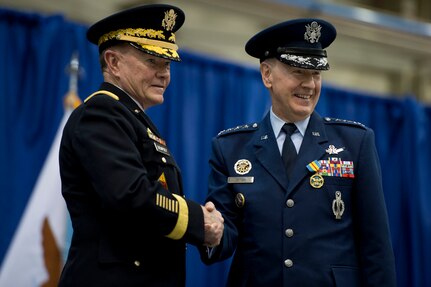 Chairman of the Joint Chiefs of Staff General Martin Dempsey congratulates General Robert Kehler during the Strategic Command change of command and retirement ceremony for Kehler at Offutt Air Force Base, Omaha, Nebraska Nov. 15, 2013. Dempsey spoke at the change of command where Kehler retired and relinquished command to Admiral Cecil Haney. Photo by Erin A. Kirk-Cuomo (Released)