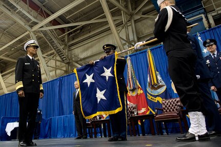 Admiral Cecil Haney watches as his flag officer flag is unfurled during the change of command ceremony at Strategic Command on Offutt Air Force Base, Omaha, Nebraska Nov. 15, 2013. Haney assumed command from General Robert Kehler during the ceremony. Photo by Erin A. Kirk-Cuomo (Released)