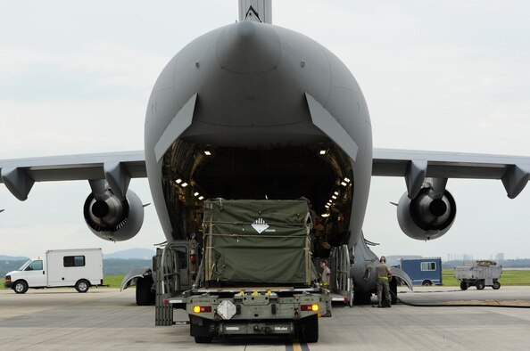A cargo truck off-loads water purifiers onto a C- 17 Globemaster III from Joint Base Pearl Harbor-Hickam, Hawaii, on Kadena Air Base, Japan, Nov. 15, 2013. This is one of many supply deliveries that will be made to assist the Philippines after Super Typhoon Haiyan. (U.S. Air Force photo/Senior Airman Marcus Morris) 
