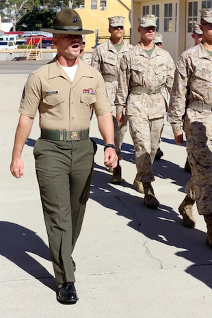 Sgt. Adi Luminare, drill instructor, Platoon 2107, Company E, 1st Recruit Training Battalion, marches his platoon aboard the depot, Nov. 1. Luminare migrated from Romania in 1991 to pursue better opportunities in the United States.