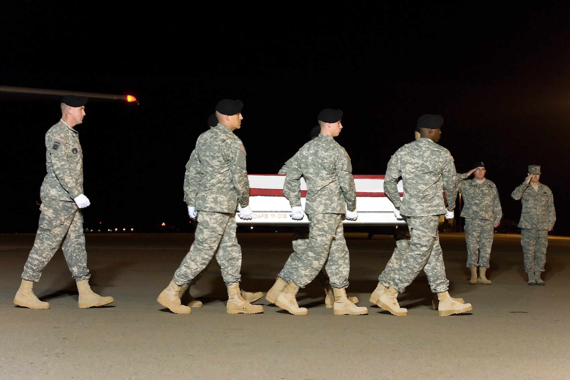 A U.S. Army carry team transfers the remains of Army Staff Sgt. Richard L. Vazquez of Seguin, Texas, Nov. 16, 2013 at Dover Air Force Base, Del. Vazquez was assigned to the 3rd Battalion, 7th Special Forces Group (Airborne), Eglin Air Force Base, Fla. (U.S. Air Force photo/Roland Balik)