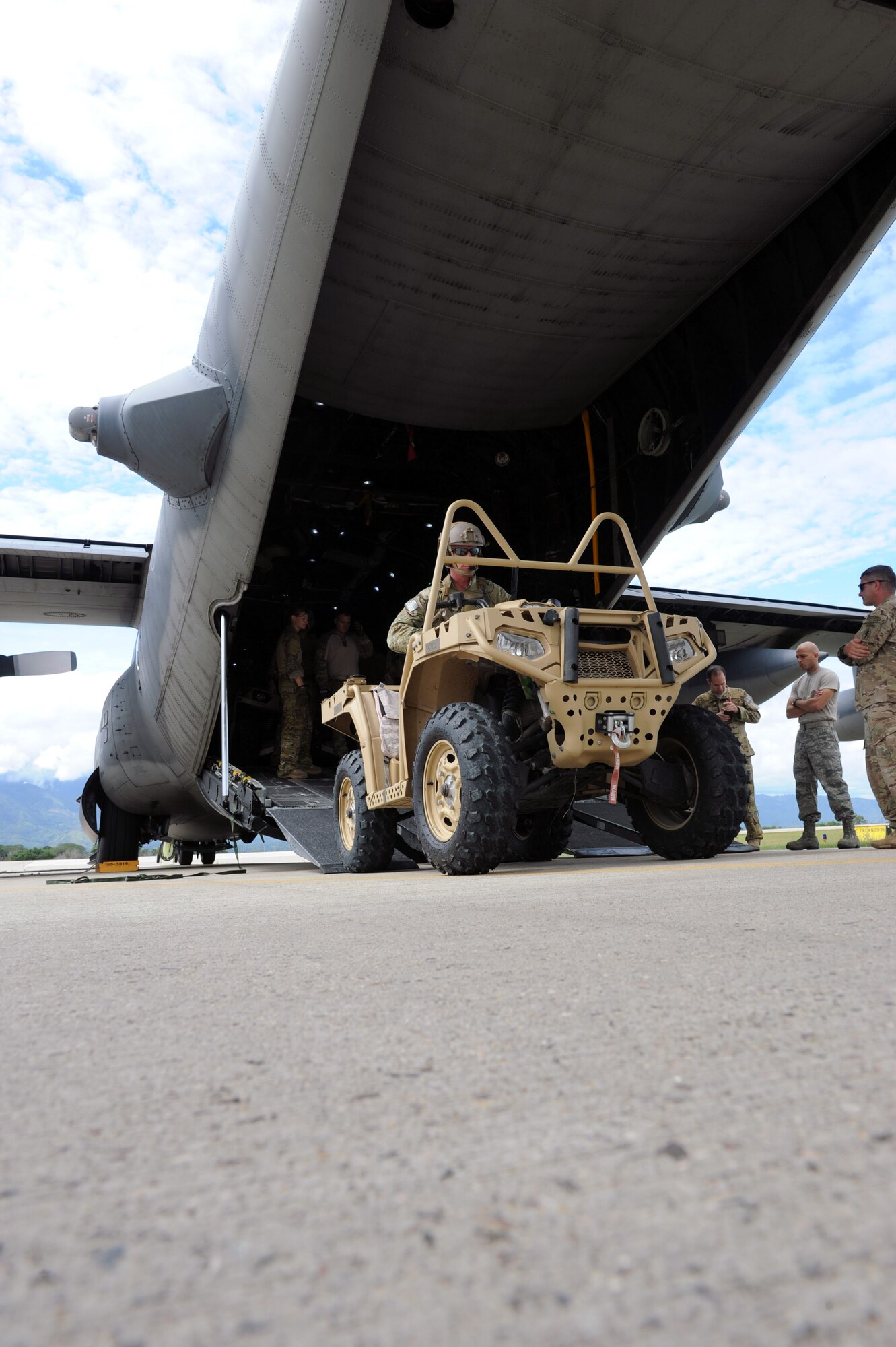 U.S. Special Forces operators from the 7th Special Forces Group (Airborne) exit a C-130 Hercules aircraft as part of RAPIDS infiltration/exfiltration training at Soto Cano Air Base, Nov. 15, 2013.  RAPIDS is a Special Forces tactic for quickly inserting and removing personnel into and out of an area, and is used for personnel recovery of an isolated individual.  (Photo by Martin Chahin)