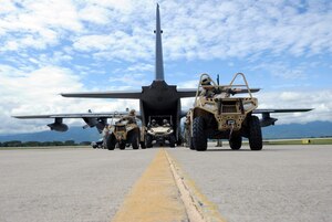 U.S. Special Forces operators from the 7th Special Forces Group (Airborne) exit a C-130 Hercules aircraft as part of RAPIDS infiltration/exfiltration training at Soto Cano Air Base, Nov. 15, 2013.  RAPIDS is a Special Forces tactic for quickly inserting and removing personnel into and out of an area, and is used for personnel recovery of an isolated individual.  (Photo by Martin Chahin)