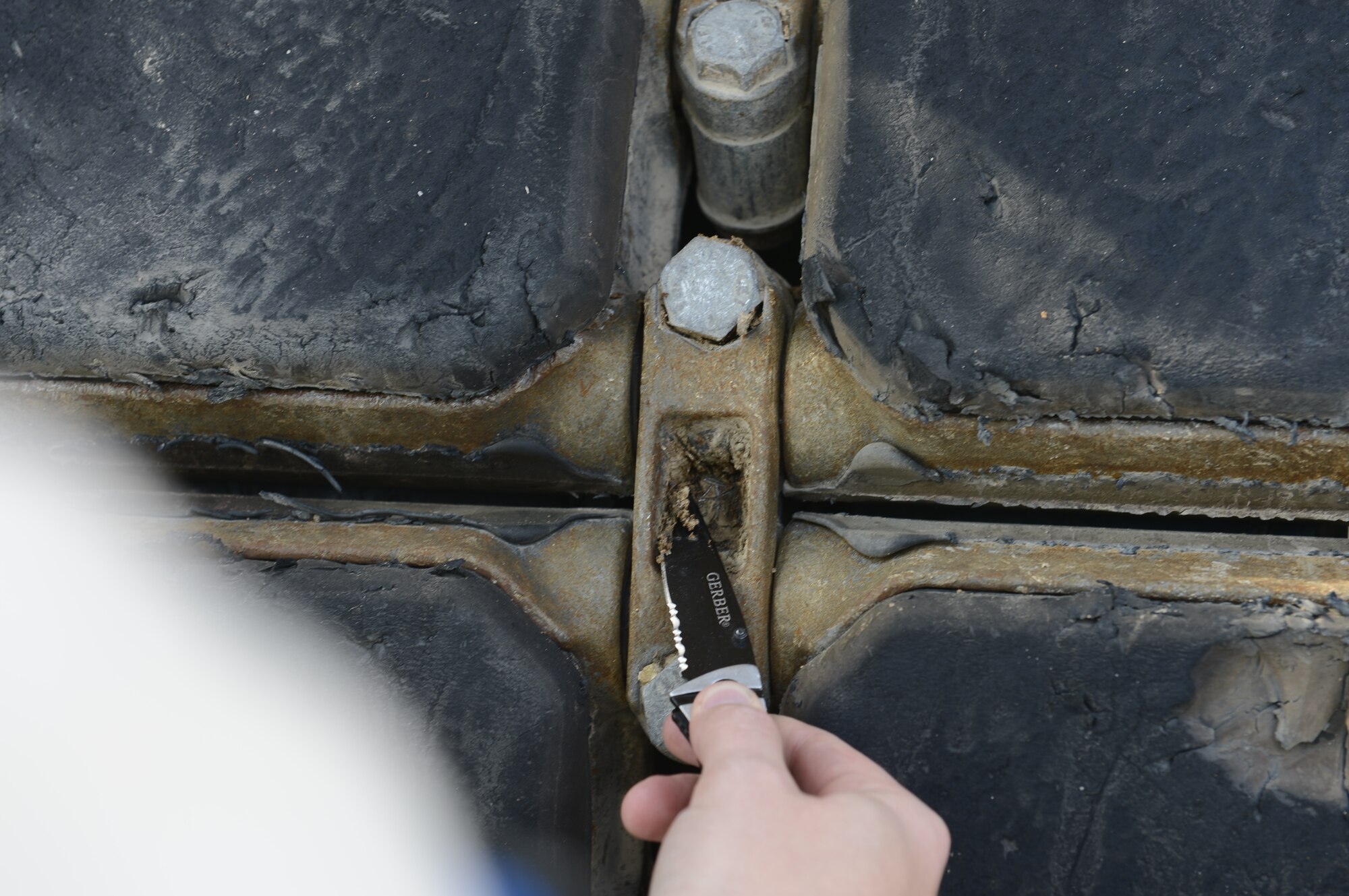 Bits of dirt collected from the wheel of this vehicle means a failed inspection.  Members of the 387th Air Expeditionary Squadron, undisclosed location, Southwest Asia, recently accepted responsibility of the U.S. Central Command’s Customs mission which means inspecting all Department of Defense personnel and materiel leaving the CENTCOM area of responsibility destined for the United States.  Guidelines state that nothing more than ‘pinchable’ dirt/sand is permitted.  (U.S. Air Force photo by Master Sgt. Christopher Campbell)