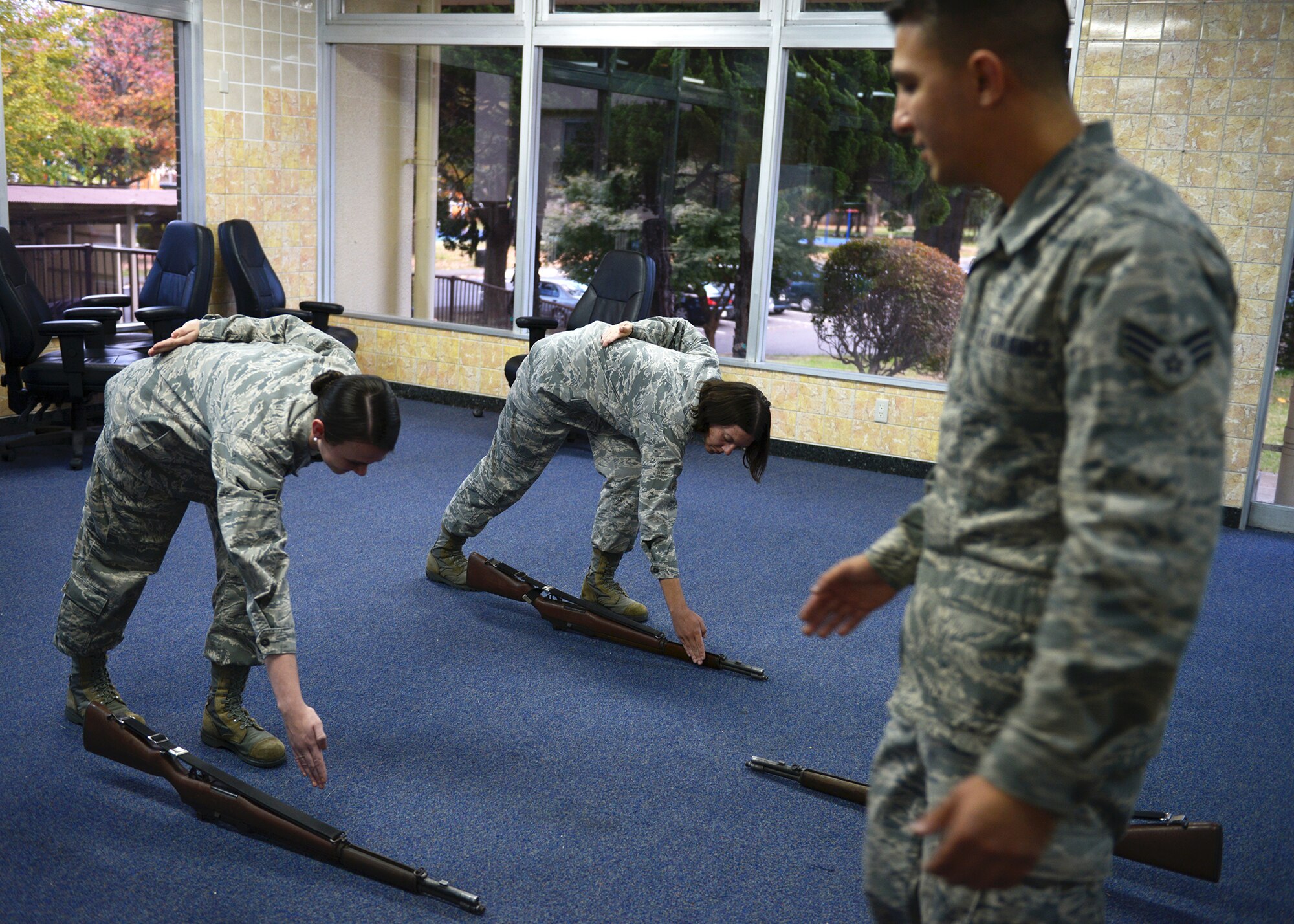 New members of the Yokota Air Base Honor Guard learn rifle techniques at Yokota Air Base, Japan, Nov. 13, 2013. As a ceremonial unit, proper form is required by those who volunteer to serve in the Honor Guard. (U.S. Air Force photo by Airman 1st Class David Danford/Released)
