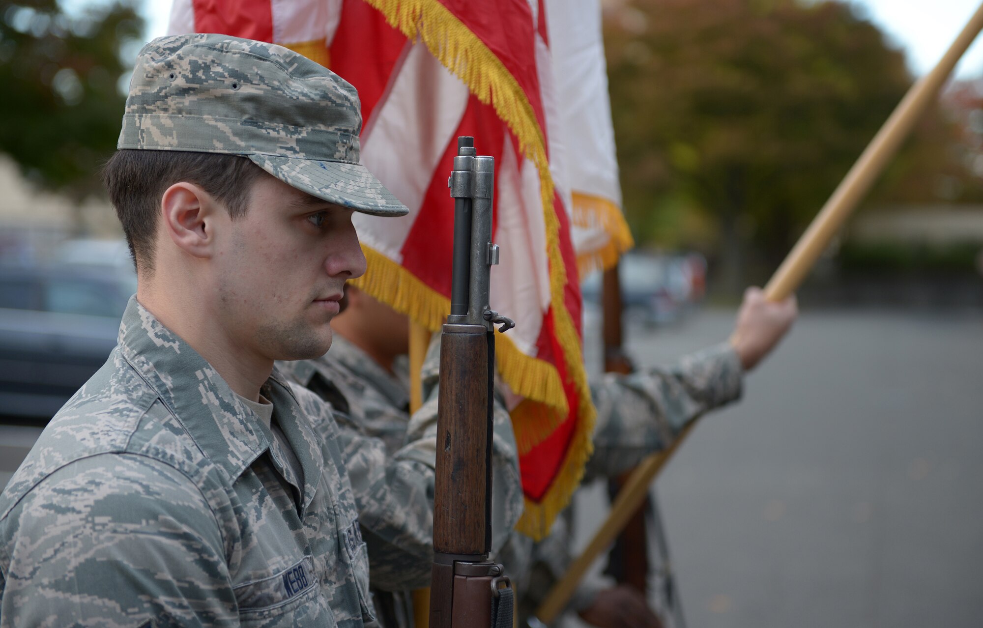 Airman 1st Class Austin Webb, Yokota Air Base Honor Guard ceremonial guardsman, holds his rifle at attention at Yokota Air Base, Japan, Nov. 13, 2013. When not serving as a ceremonial guardsman Webb works at the 374th Medical Support Squadron. (U.S. Air Force photo by Airman 1st Class David Danford/Released)