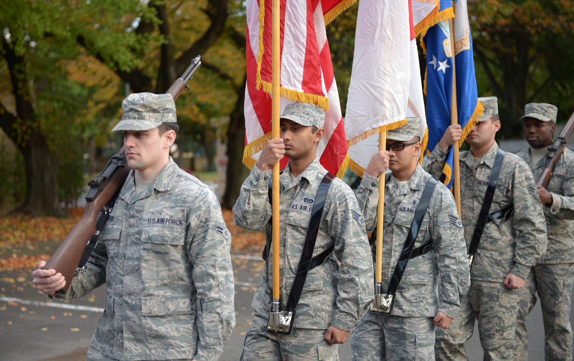 Members of the Yokota Air Base Honor Guard practice a flag march at Yokota Air Base, Japan, Nov. 13, 2013. The flag march is used at the start of award presentations, retirement ceremonies and other official functions. (U.S. Air Force photo by Airman 1st Class David Danford/Released)