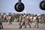 The 433rd Airlift Wing held a wing wide FOD walk on the Nov. 17 during Maintenance Group's down-day, Rodeo. Airmen competed in teams to search for foreign object damage on the flight line. Included in the FOD were two commander's coins. (U.S. Air Force photo/Technical Sgt. Carlos J. Trevino)