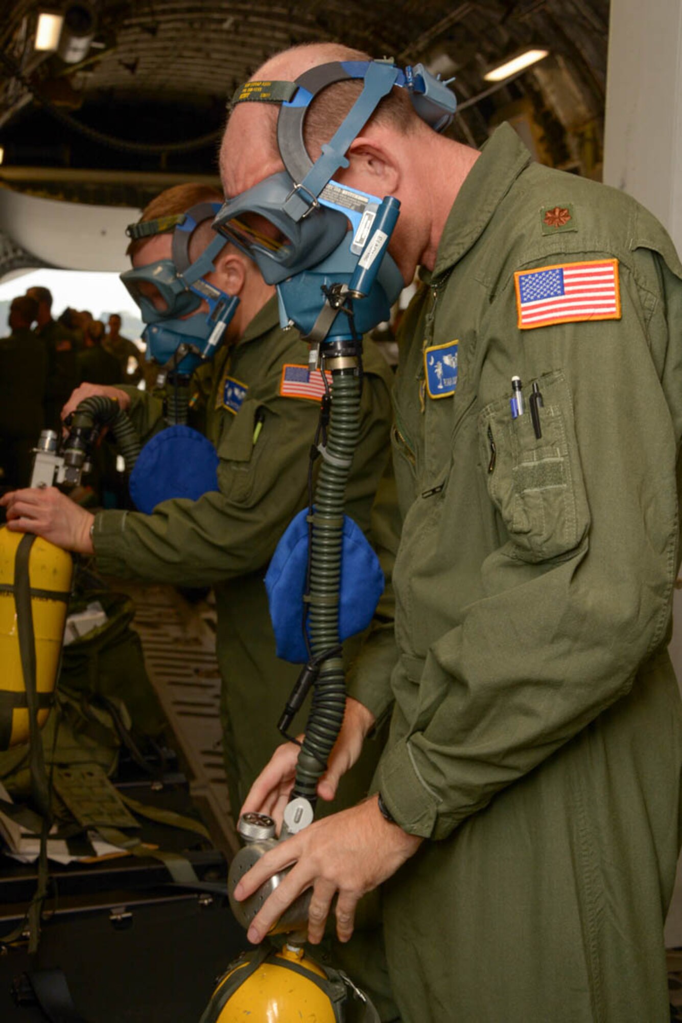 Members of the 315th Aeromedical Evacuation Squadron test emergency equipment on board a C-17 Globemaster III aircraft Nov. 17, 2013 during a routine training flight at Joint Base Charleston, S.C. (U.S. Air Force Photo by Tech. Sgt. Shane Ellis/released)