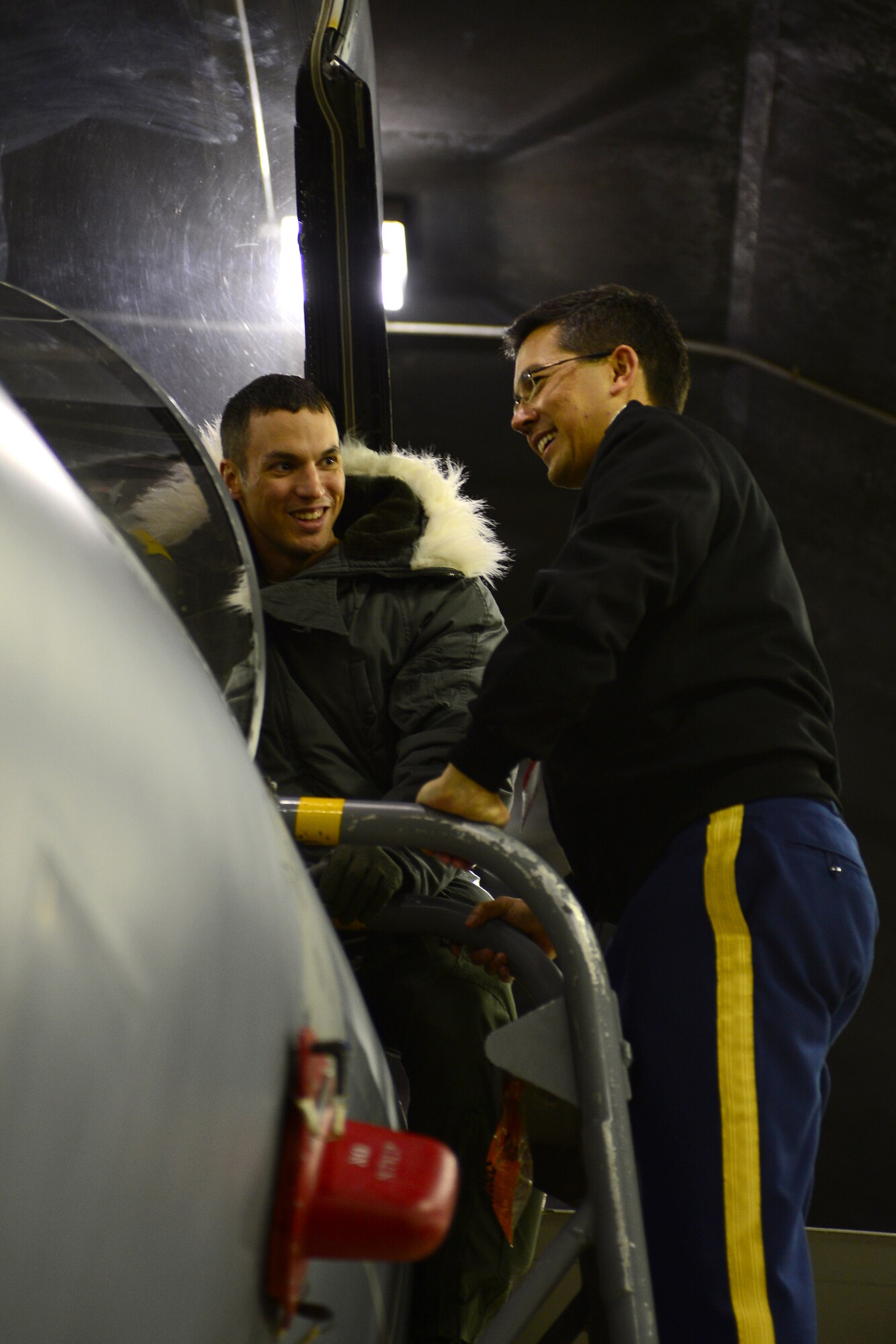 Maj. Jason Bianchi, 48th Air Expeditionary Group liaison officer, shows U.S. Army Col. Mark Derber, Baltic Defence College director of joint command and general staff course, the inside of an F-15C Eagle cockpit during a tour at Keflavik International Airport, Iceland, Nov. 14, 2013. The 48th Air Expeditionary Group conducts tours to highlight and further explain why the U.S.  Air Force conducts air policing and surveillance missions while deployed to Iceland. Visiting groups also received aircraft static displays of a KC-135 Stratotanker and a C-130J. (U.S. Air Force photo by Airman 1st Class Dana J. Butler/Released)