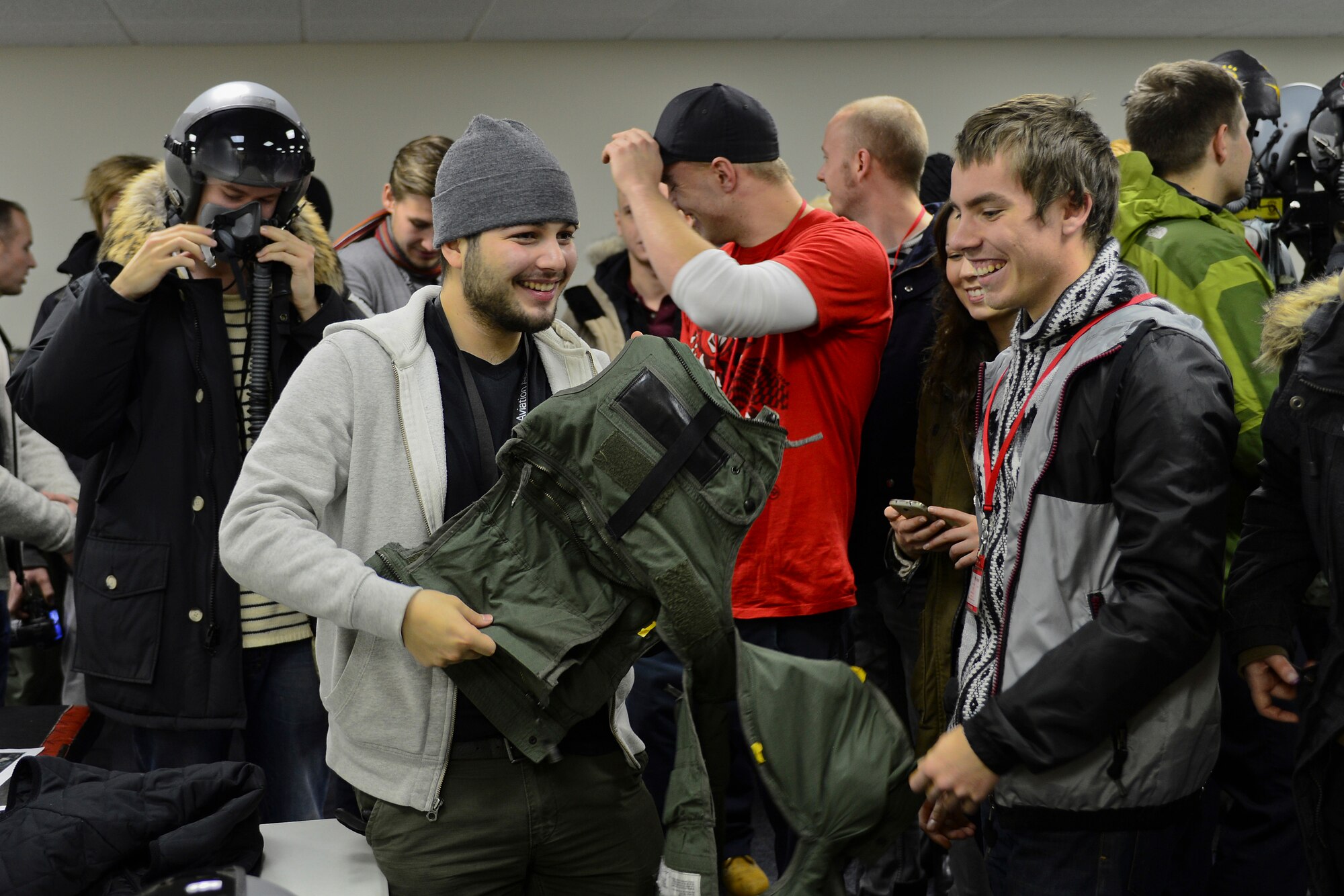 Students from Keilir Flight Academy learn about aircrew flight equipment during a tour of the 493rd Expeditionary Fighter Squadron at Keflavik International Airport, Iceland, Nov. 14, 2013. The 48th Air Expeditionary Group conducts tours to highlight and further explain why the U.S.  Air Force conducts air policing and surveillance missions while deployed to Iceland. Visiting groups also received aircraft static displays of an F-15C Eagle, KC-135 Stratotanker and a C-130J. (U.S. Air Force photo by Airman 1st Class Dana J. Butler/Released)