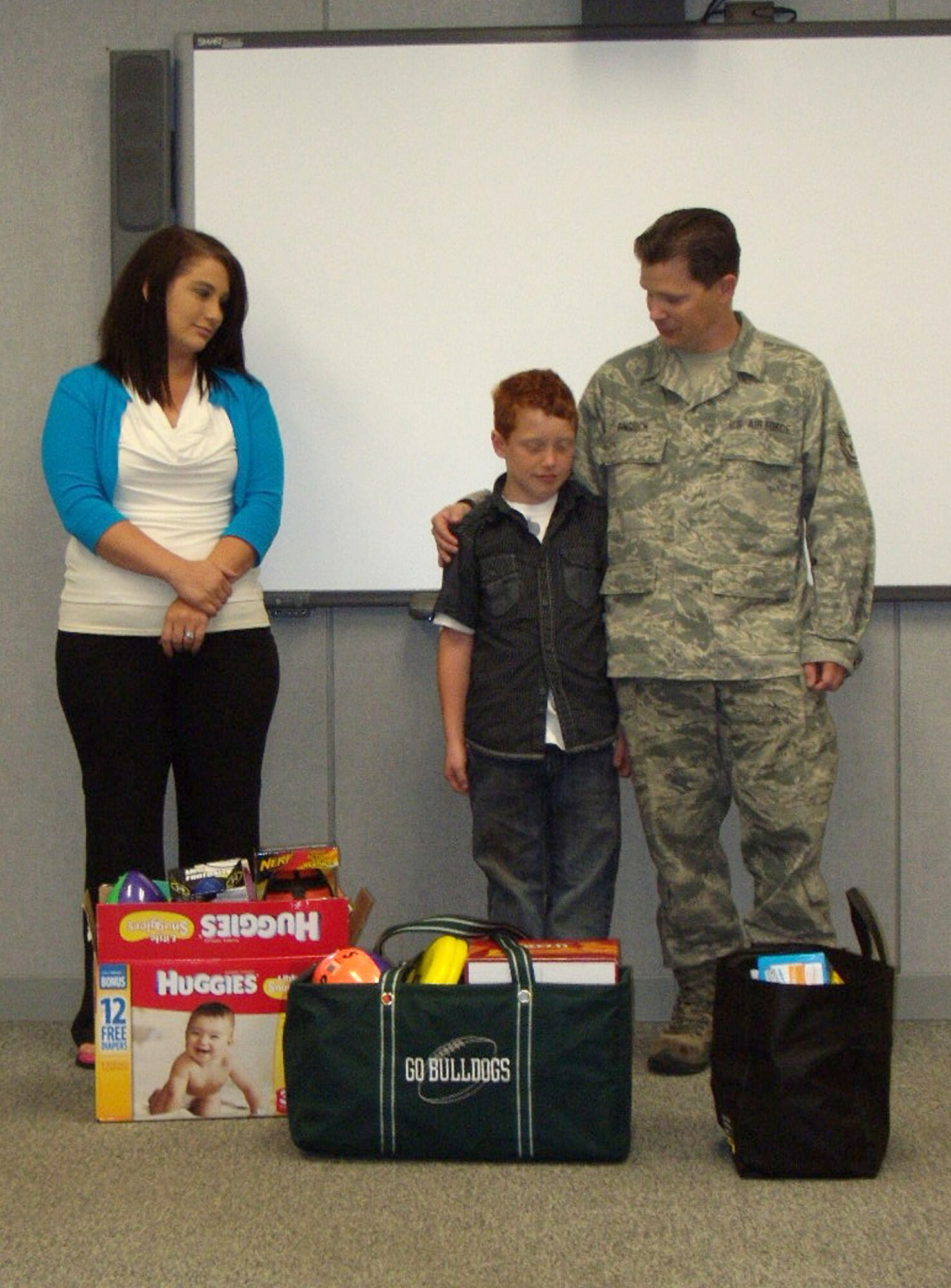 Aidyn Gingrich, son of Tech. Sgt. Ryon Gingrich, 193rd Special Operations Maintenance Group, stands with items he was given for his birthday – donations for the Hershey Food Bank and items to send to deploying service members. He donated 87 pounds of food to the Food Bank and three boxes to deploying Airmen. (Photos by Tech. Sgt. Crystal Mentzer)    