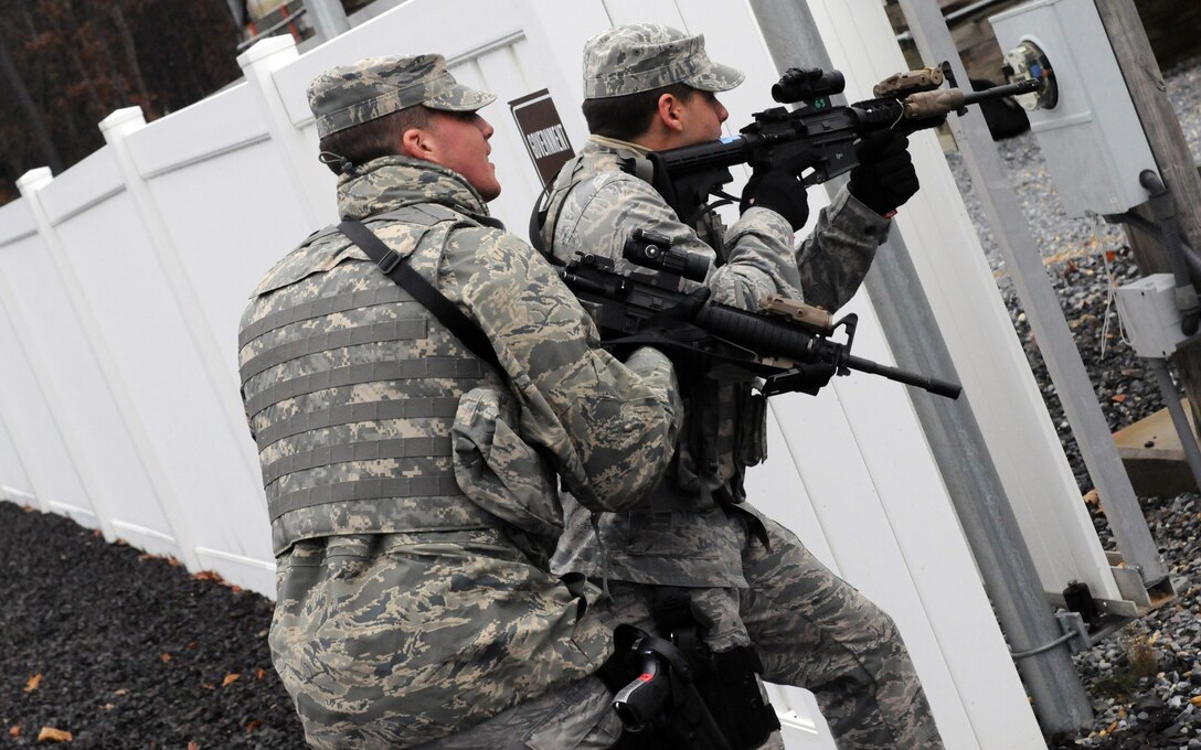 Airmen from the 177th Security Forces Squadron practices proper technique while entering a compound during an exercise scenario on Nov.16, 2013 at the FAA Training Facility, N.J.  Airmen practiced scenarios ranging from room clearing to entry procedures during the exercise.  (U.S. Air National Guard photo by Airman First Class Shane Karp/Released)