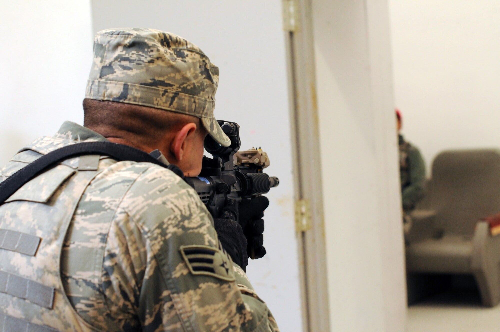 A picture of an airman from the 177th Security Forces Squadron practicing to clear a room.