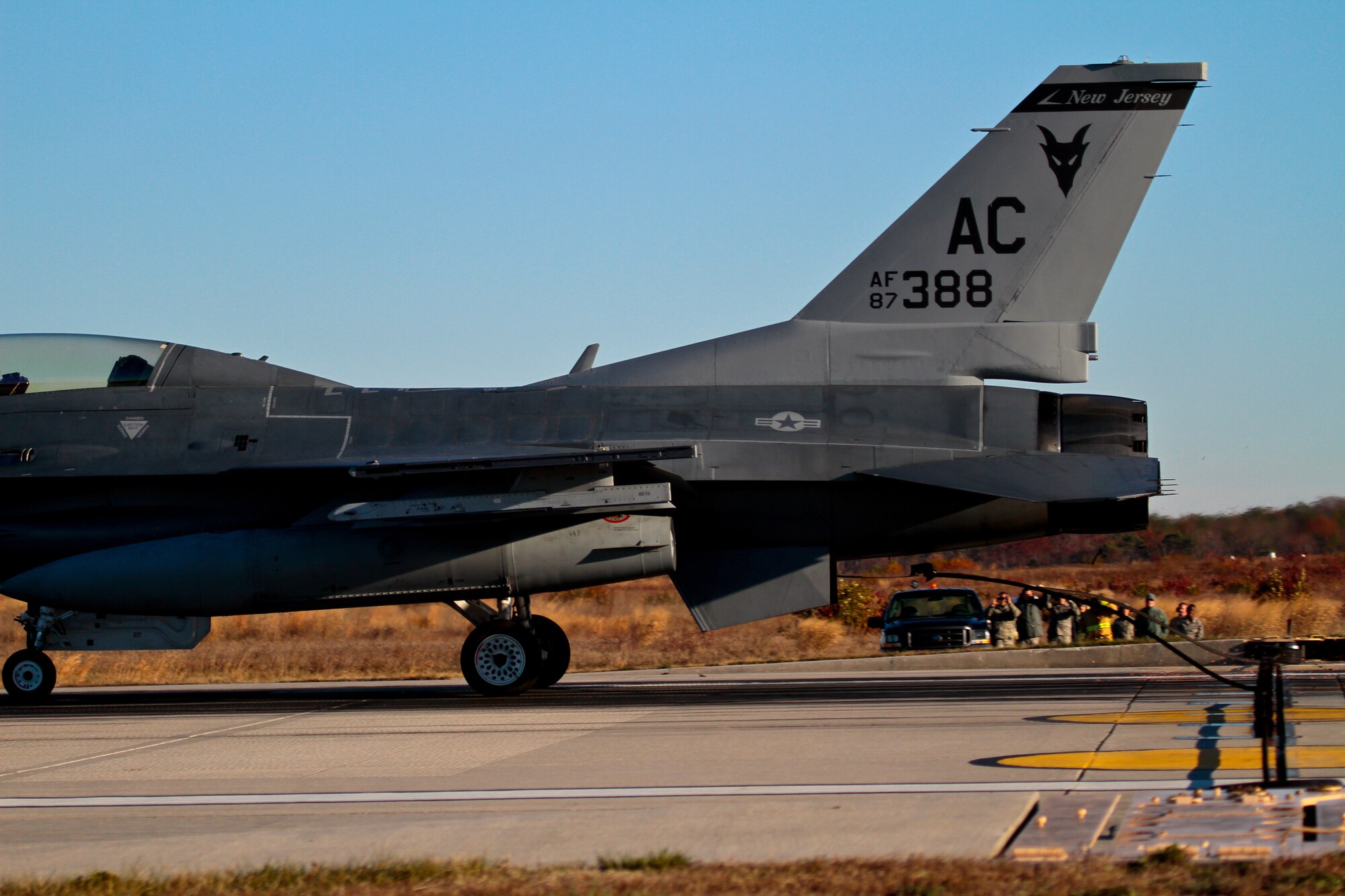 A picture of a U.S. Air Force F-16D, piloted by Maj. Jason Halvorsen, catching an arrestor cable with it's tailhook.