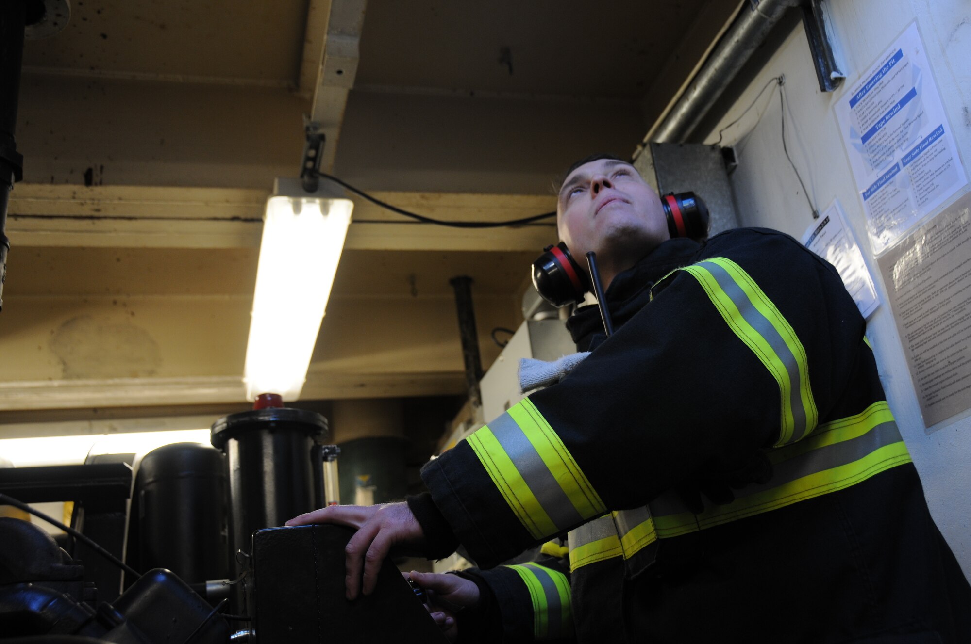A picture of an airman from the 177th Civil Engineering Squadron Fire Department awaiting a signal.