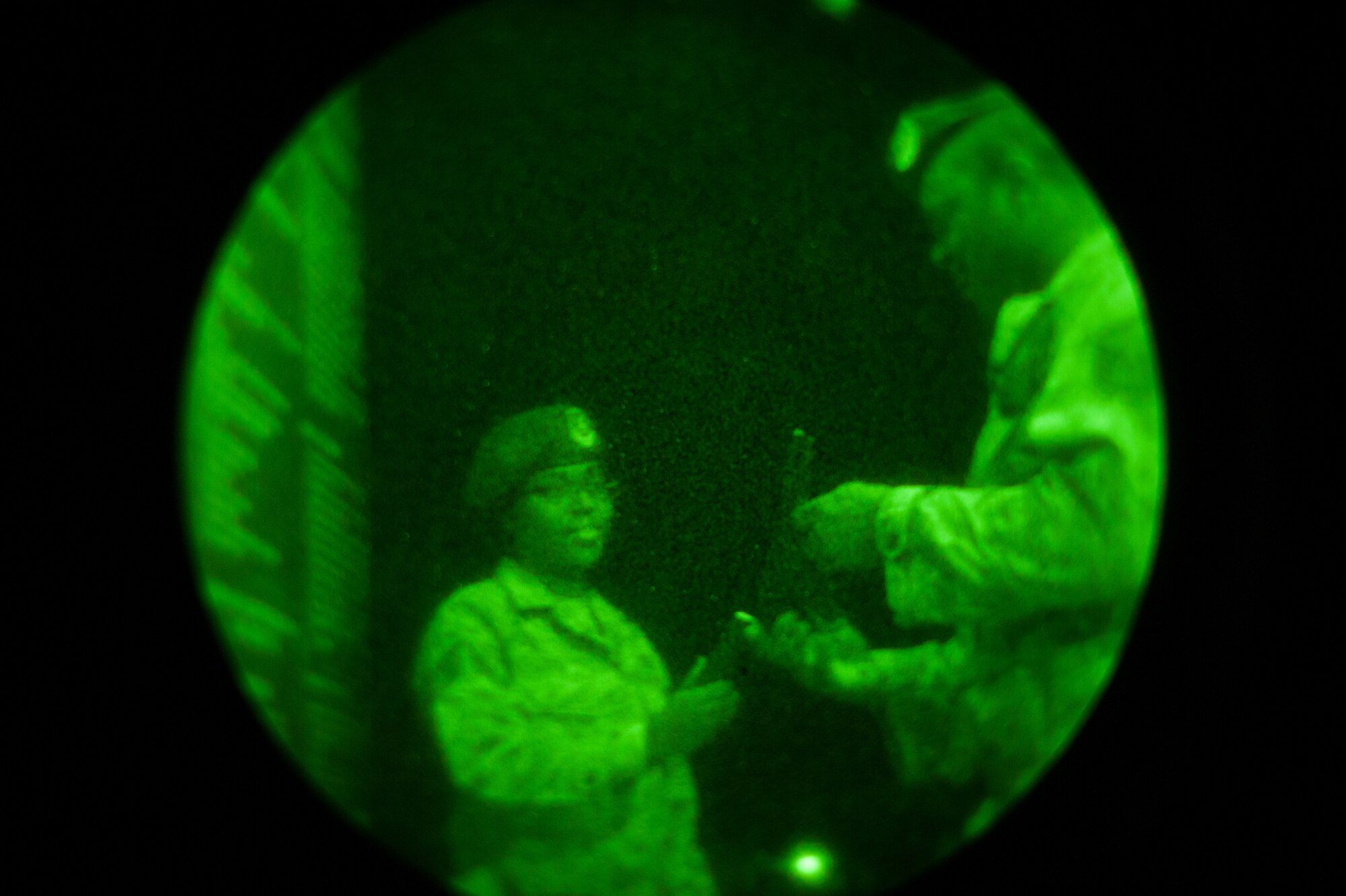 Staff Sgt. Demenica Vick, 8th Security Forces Squadron, hands Master Sgt. Ricky Brazell, 8th Security Forces Squadron, a magazine for his M-9 in preparation for a his night shift during exercise Beverly Bulldog 14-1 at Kunsan Air Base, Republic of Korea, Nov. 17, 2013. The 8th Fighter Wing is testing its wartime mission alongside other 7th Air Force units and supporting organizations with an emphasis on the operational and tactical levels of war during the peninsula-wide exercise. (U.S. Air Force photo by Senior Airman Armando A. Schwier-Morales/Released)